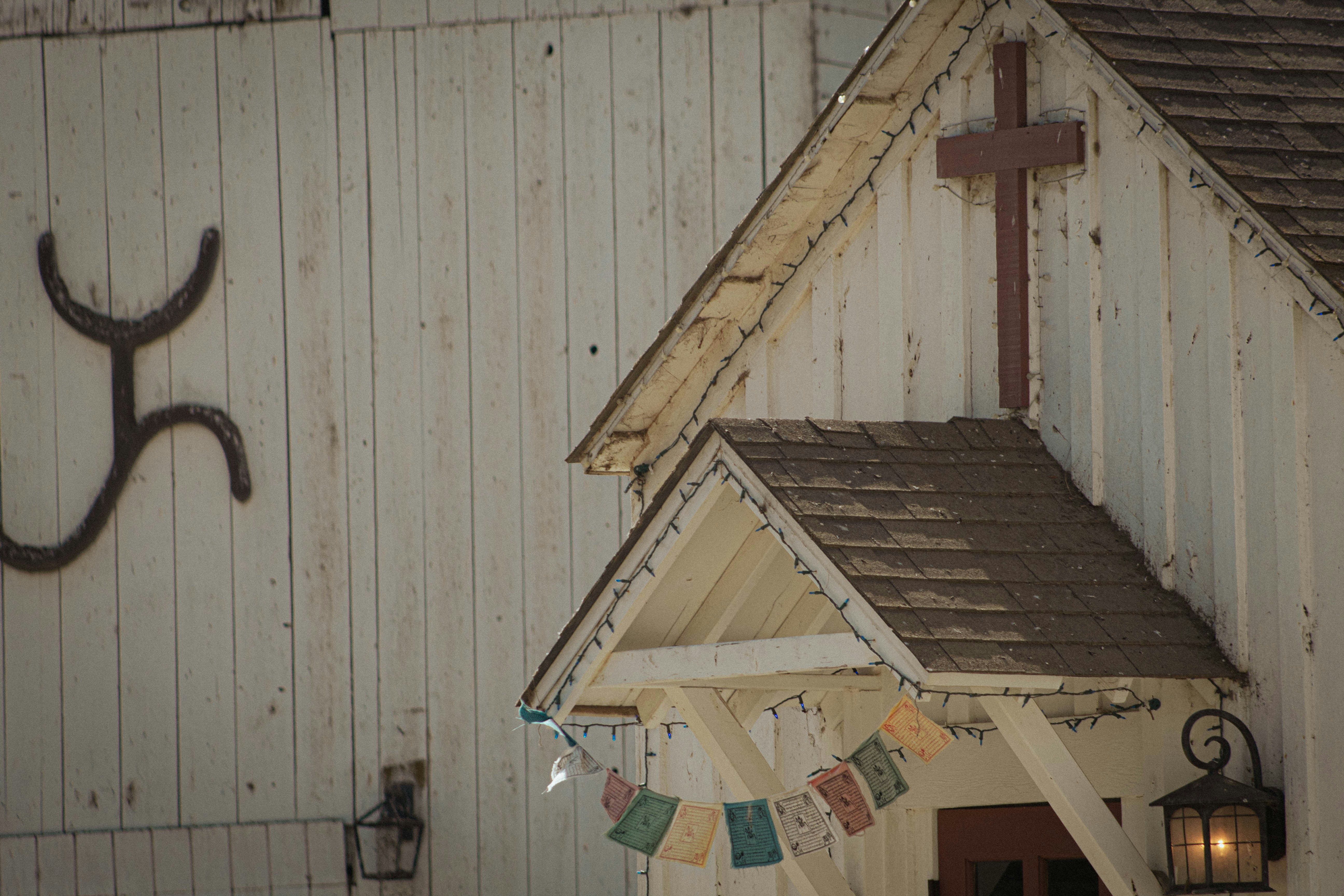 A church with a cross and rustic details.