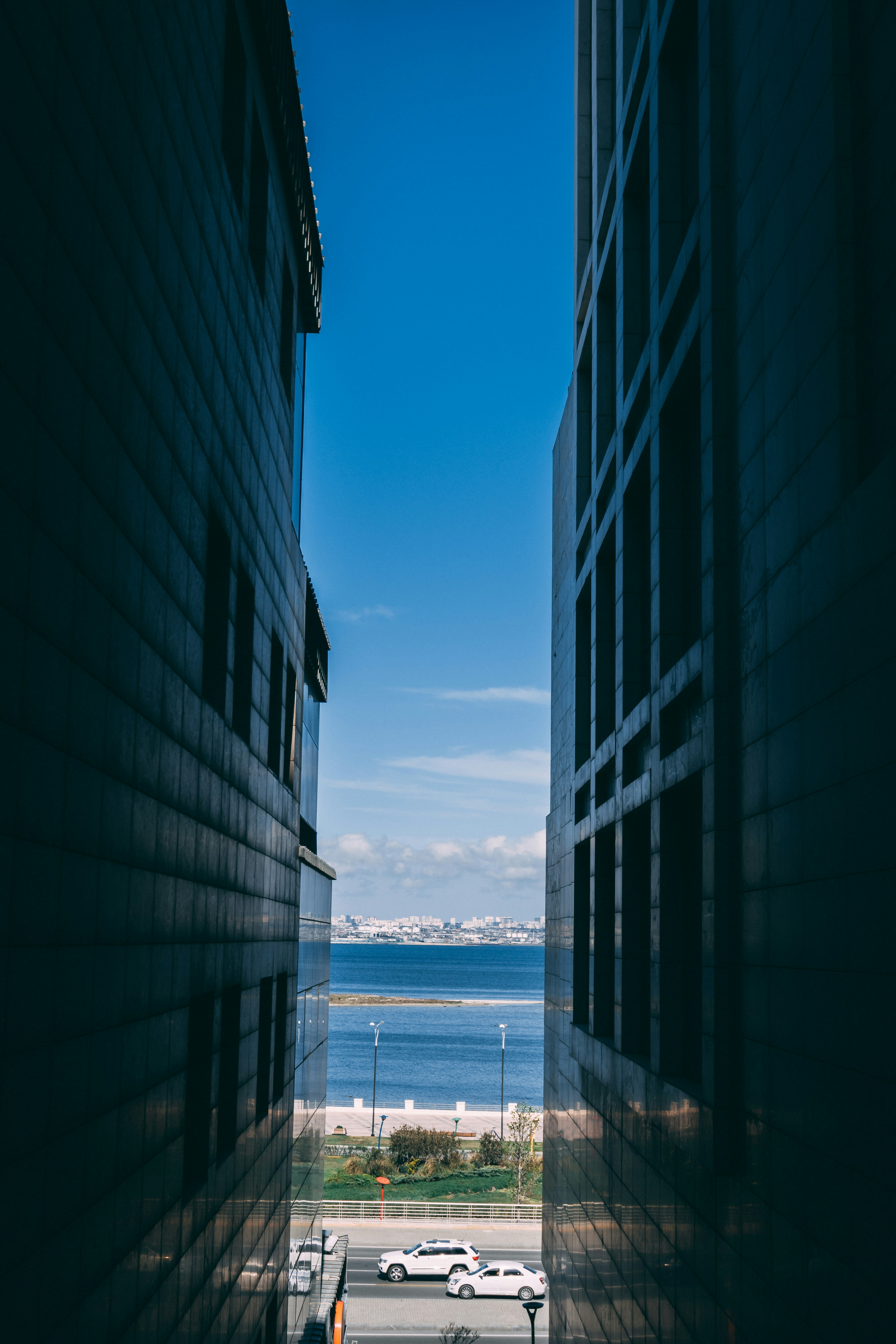 Buildings frame the view of the sea and sky.