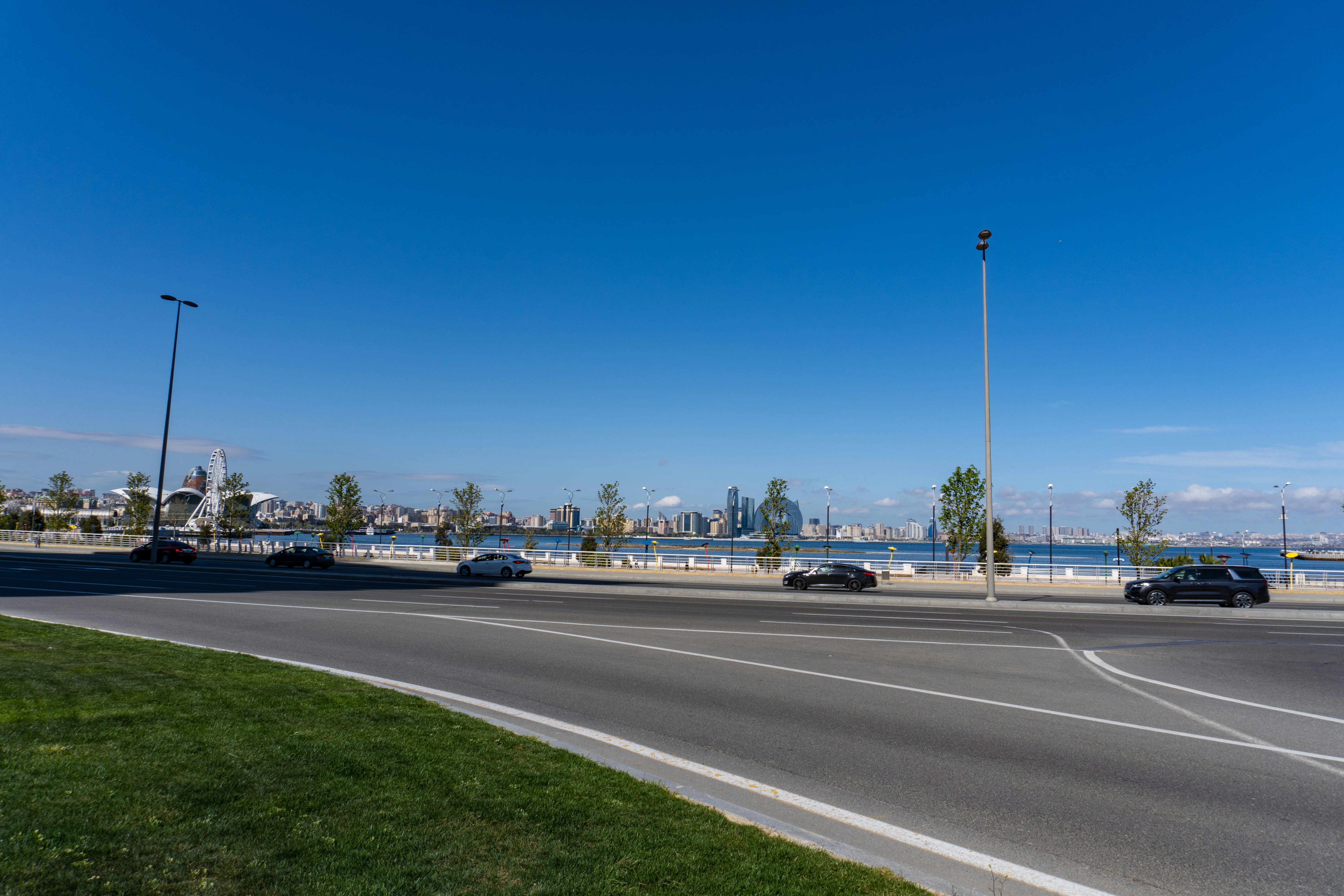 Roadside view with a city skyline in the distance.
