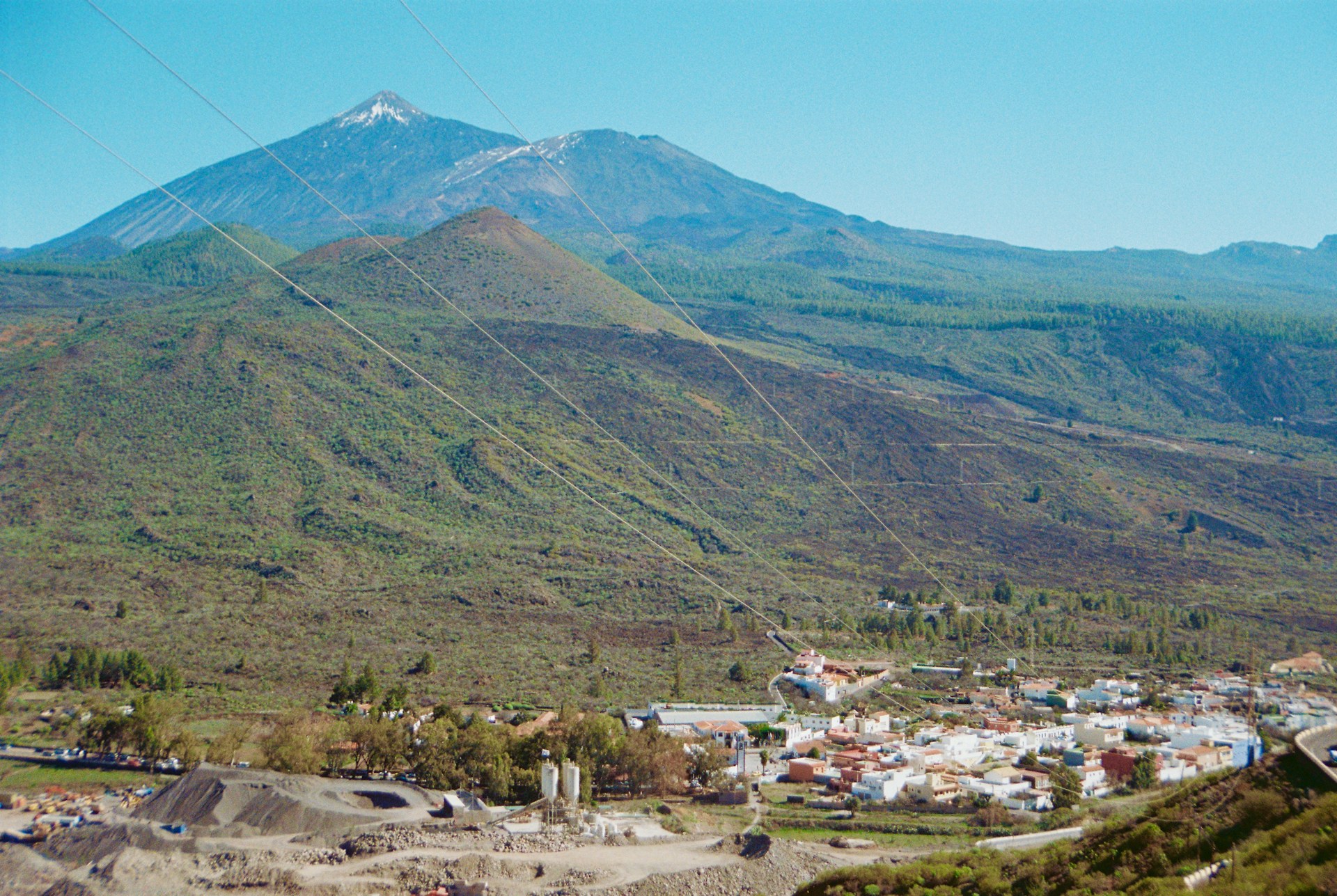 A majestic mountain overlooks a small town.