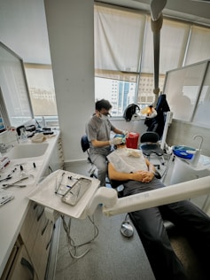 A dentist is providing care to their patient.