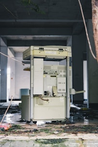 Abandoned office building with a broken photocopier.