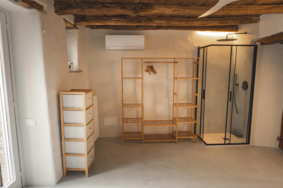 open closet system with shelves drawers and hanging space