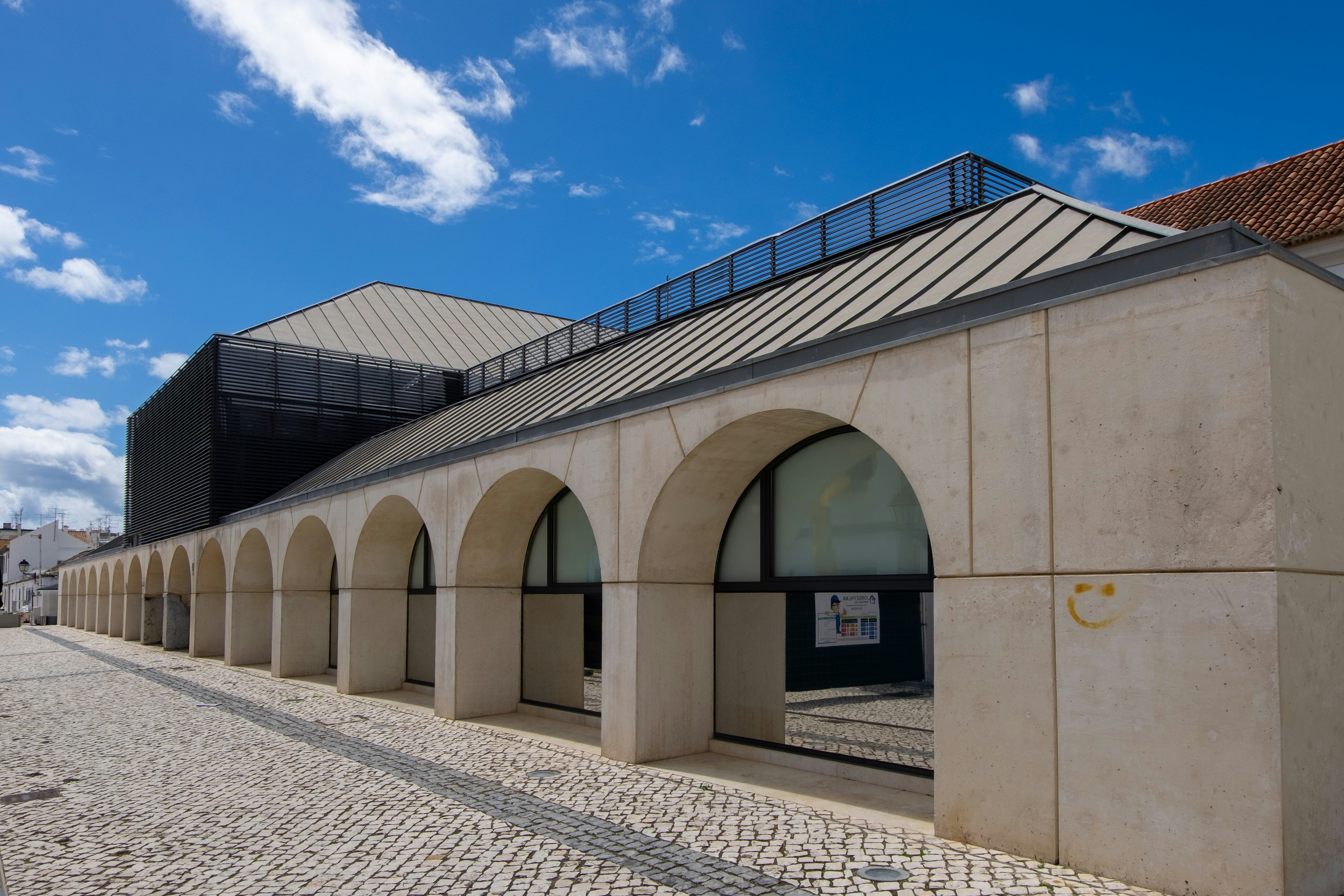 A modern building with arched entryways.