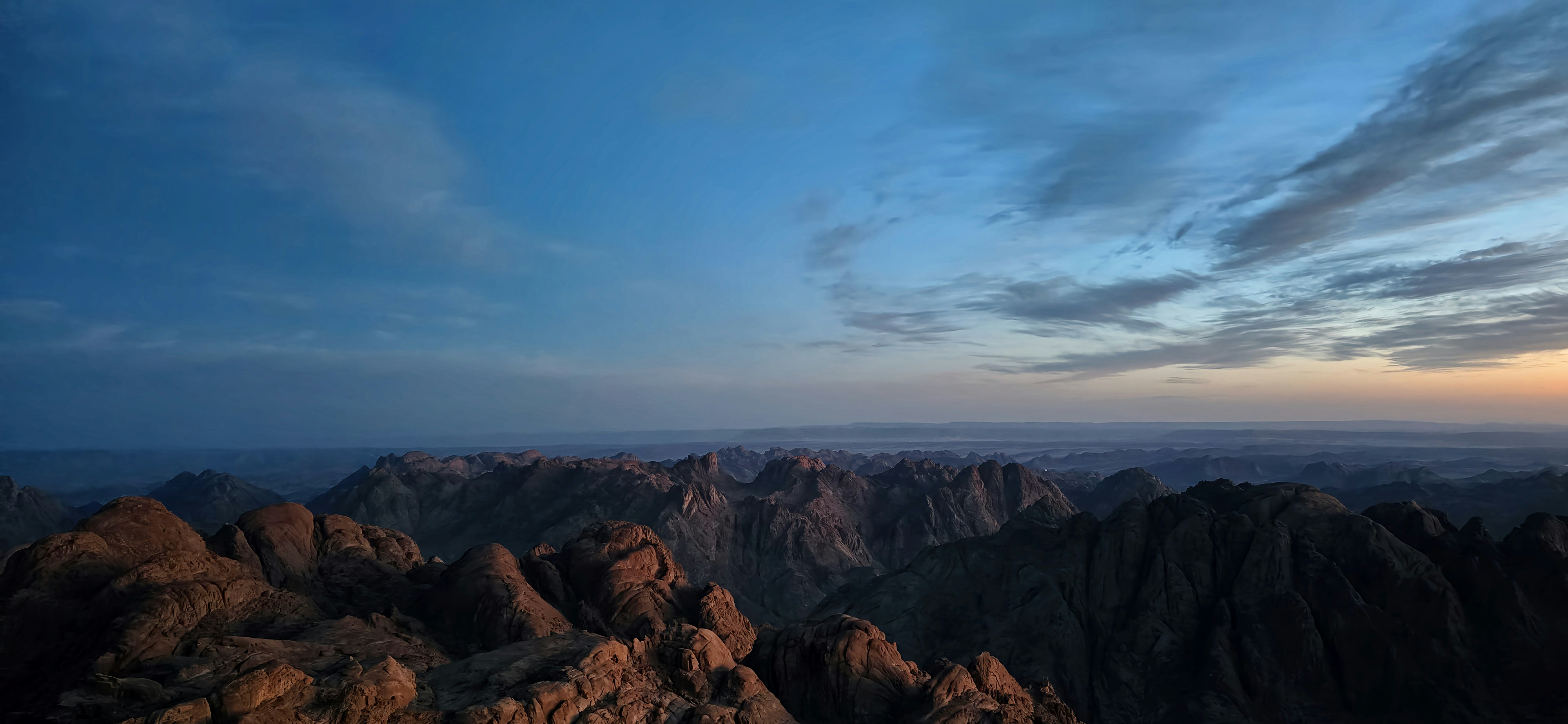 Mountains are seen under a beautiful, cloudy sky., Discover the breathtaking beauty of Jabal Mousa (Mount Moses) through stunning photographs. Explore high-resolution images capturing the mountain