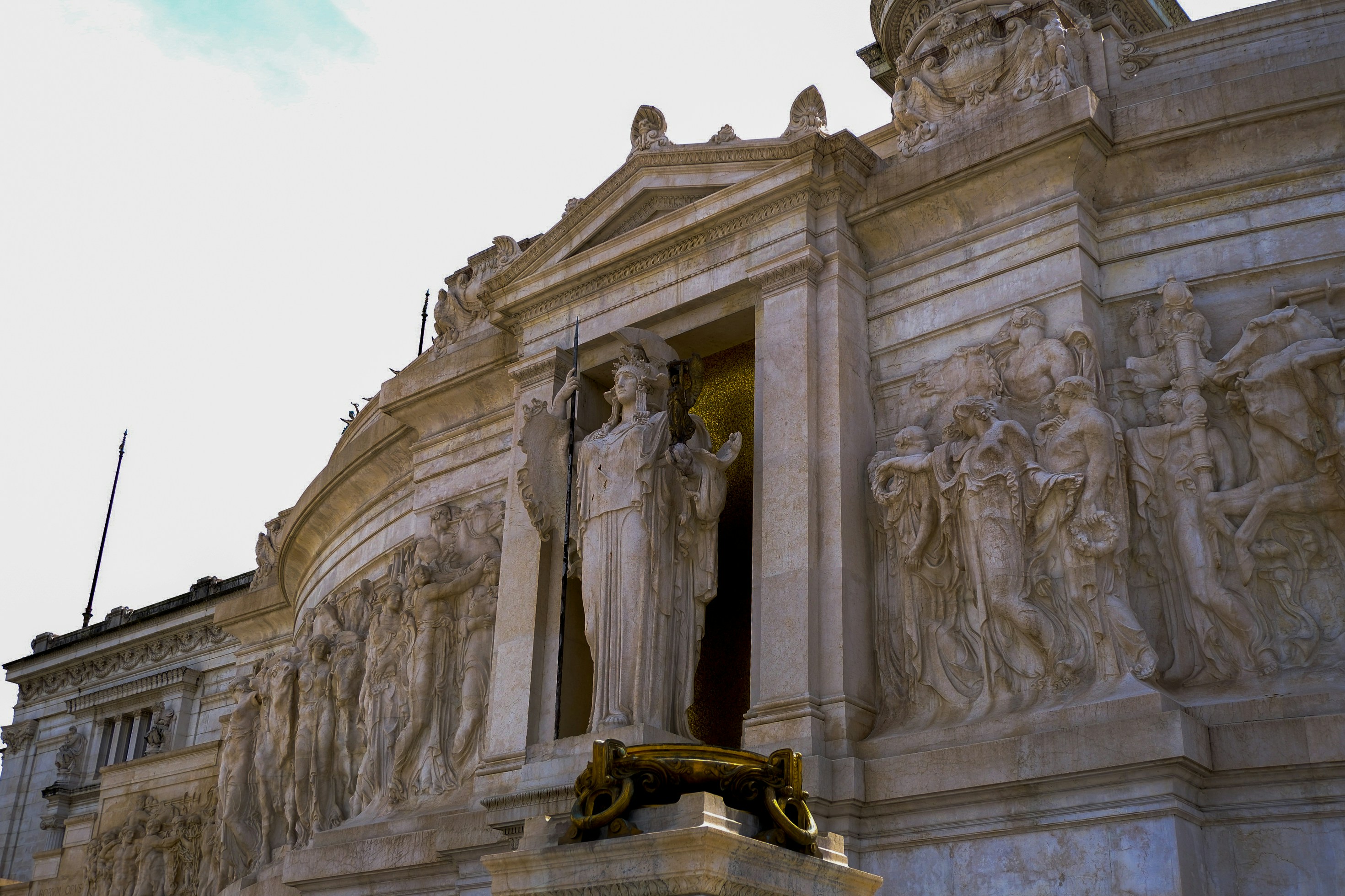 A large, ornate building with sculptures.