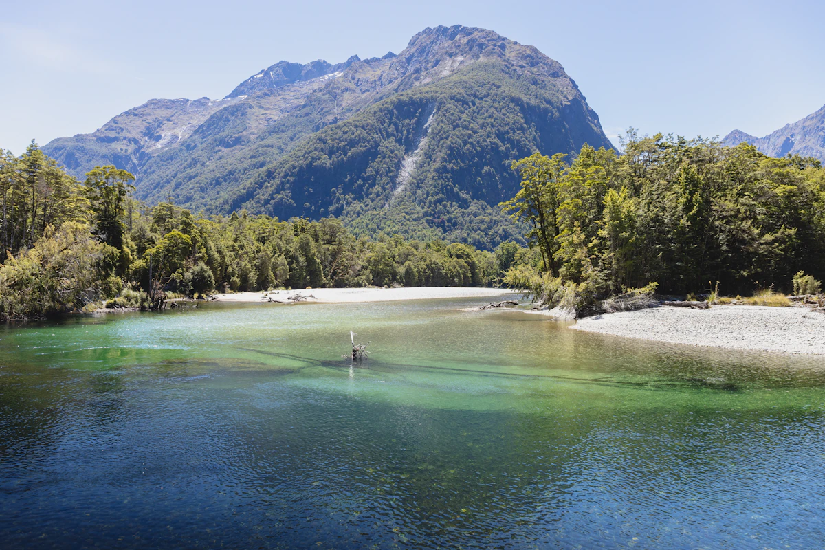 Mountain river with crystal-clear water between hills