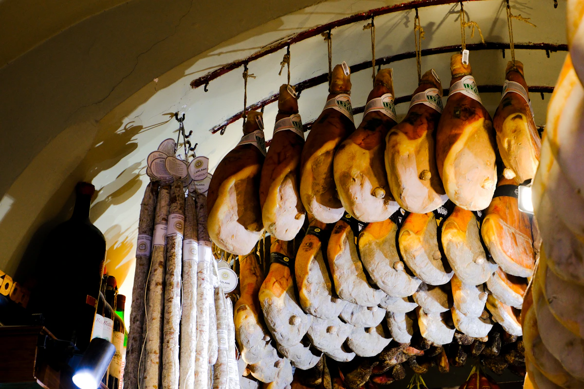 Premium cured Iberian ham hanging in traditional curing cellar