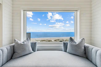 A window seat offers a beautiful ocean view.