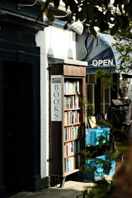 A bookshop with books stands open outside.