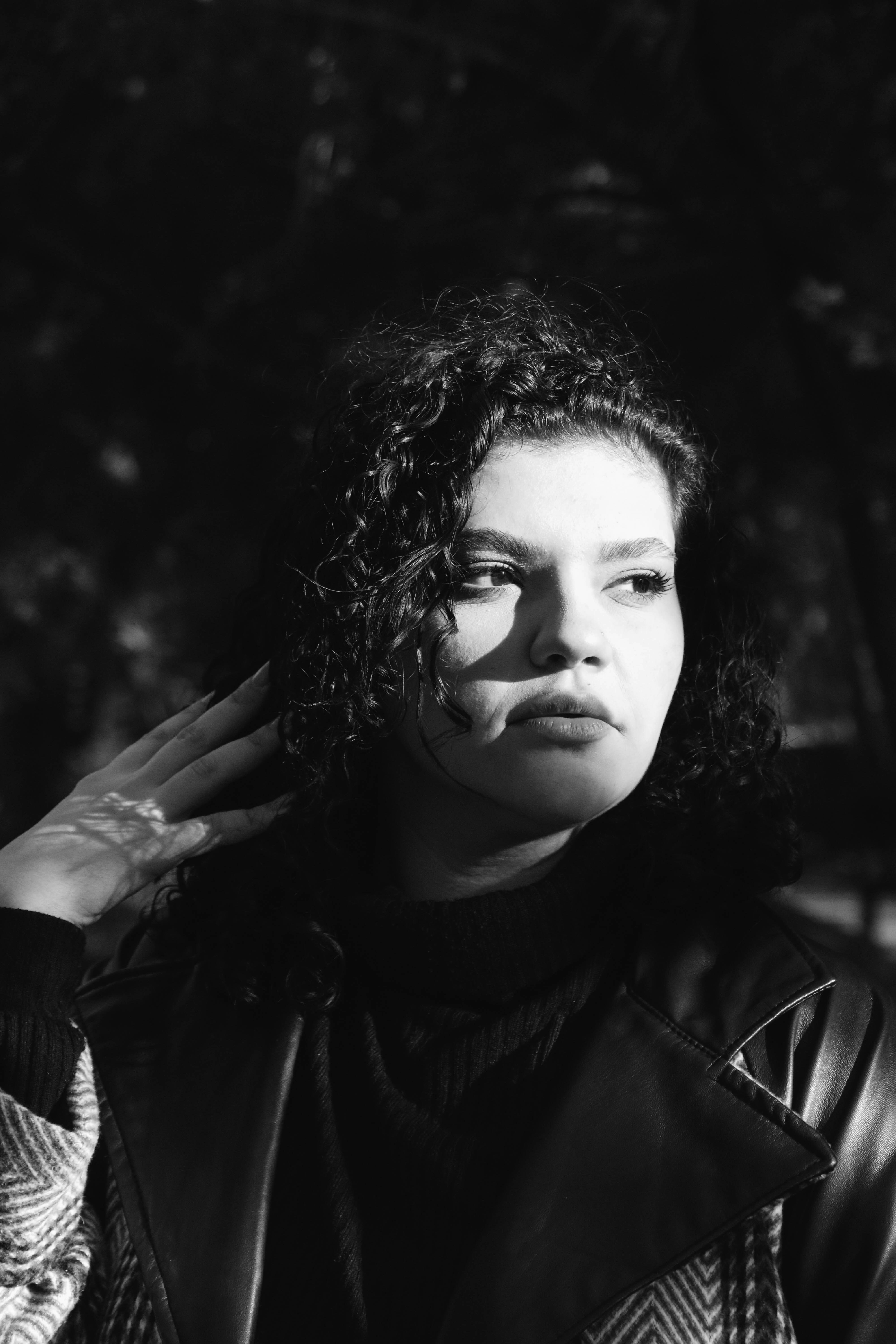 A woman is looking off to the side.