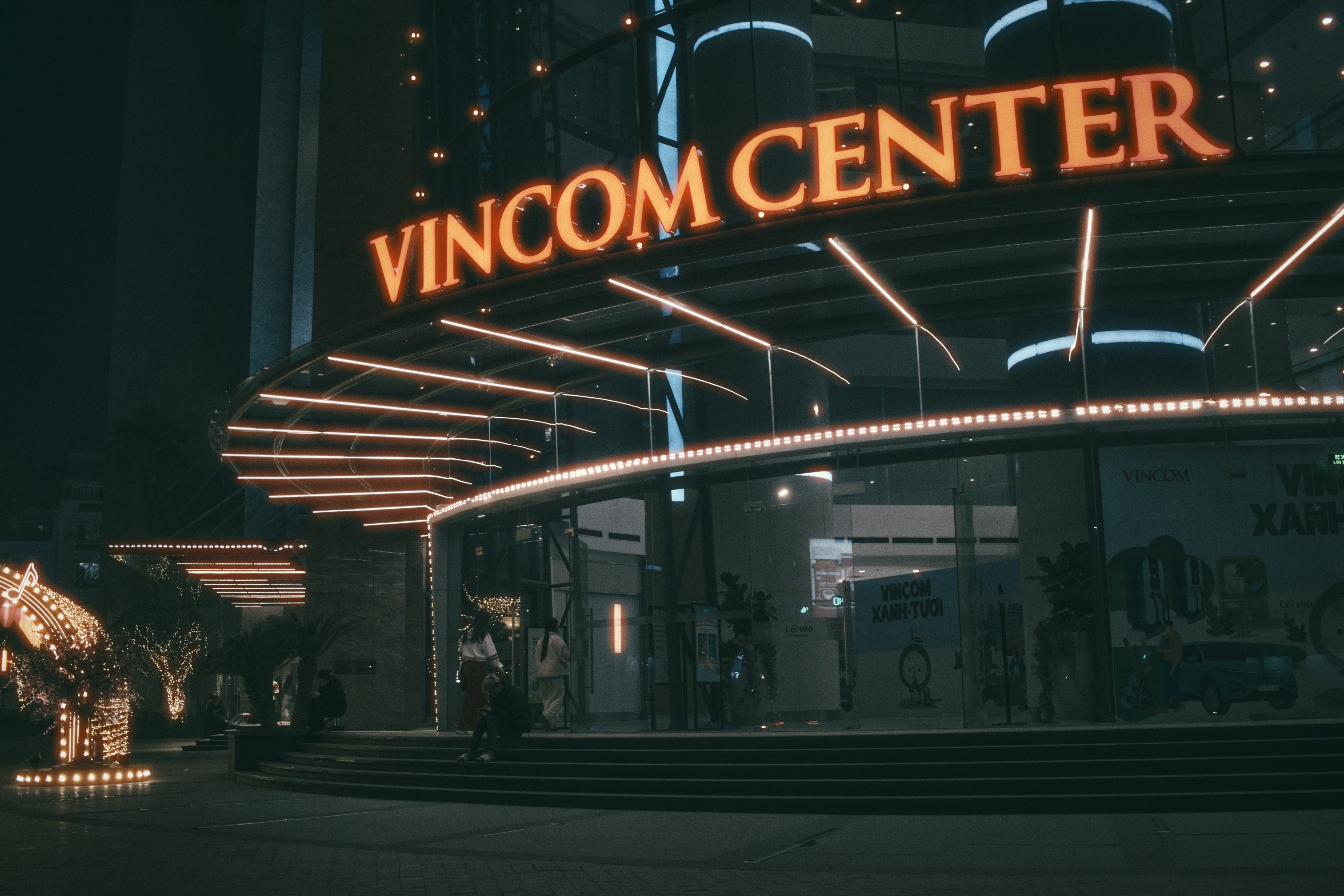 Vincom center shines at night with bright lights.