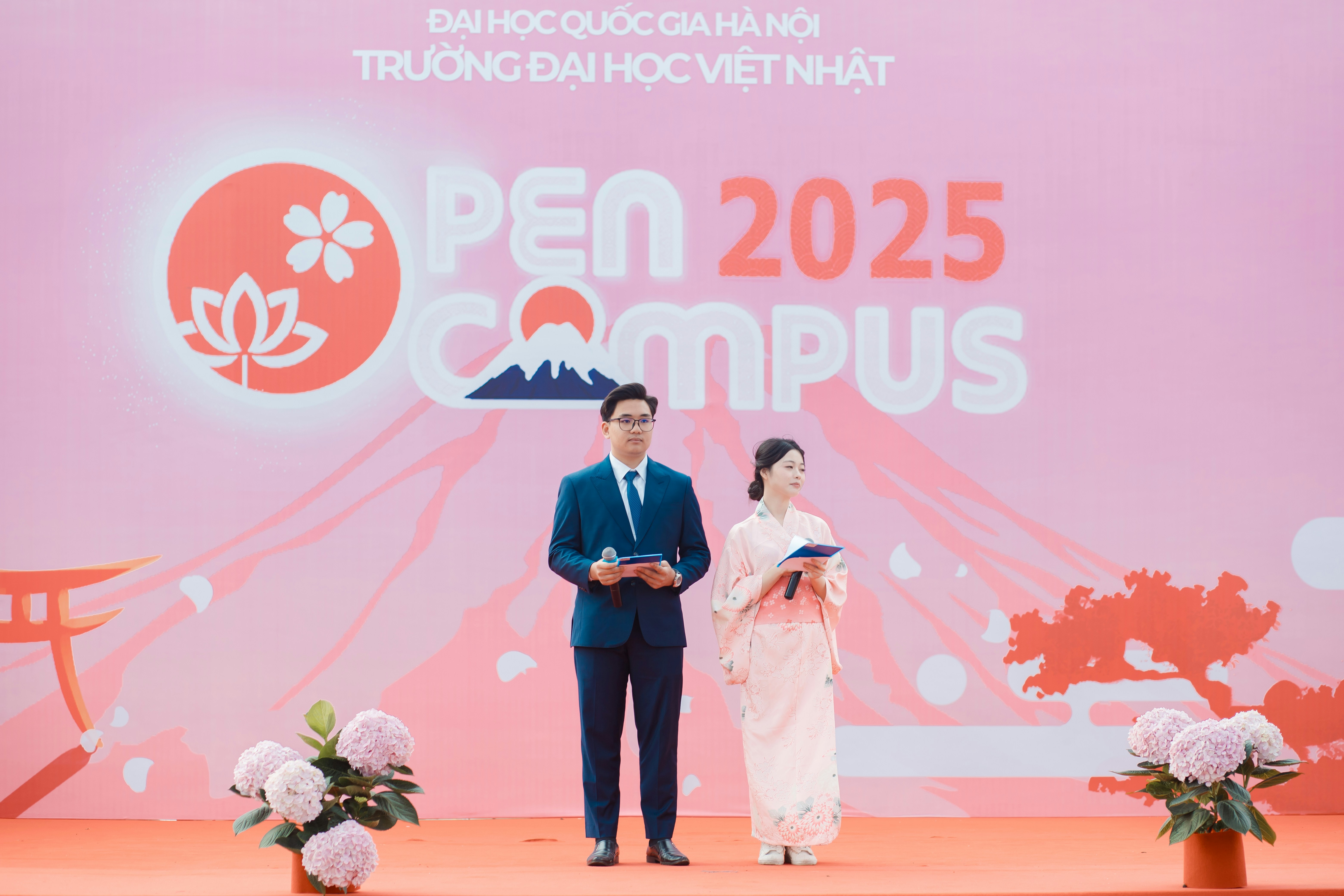 Two people present at an open campus event.