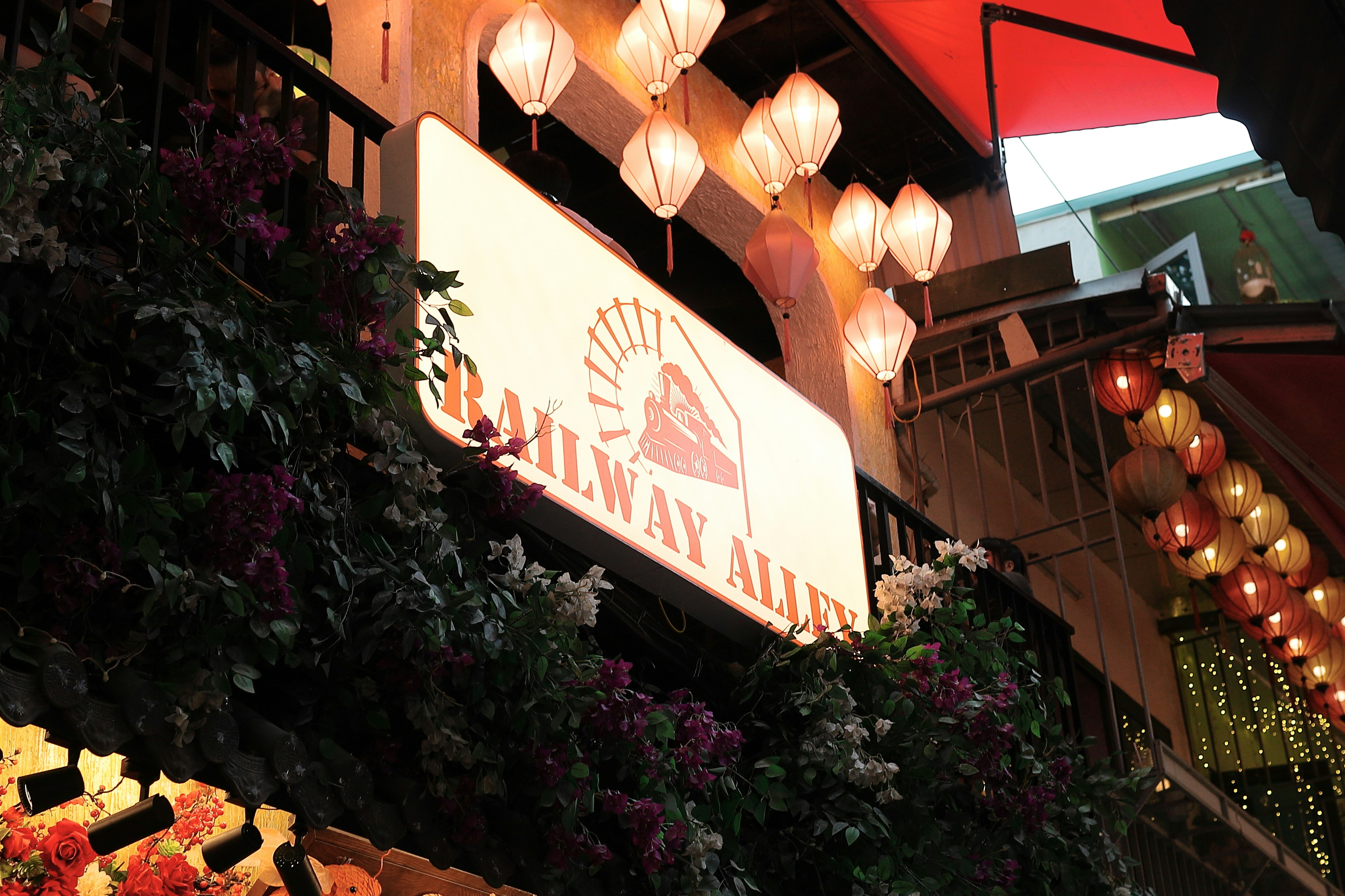 A restaurant sign displays "railway alley".