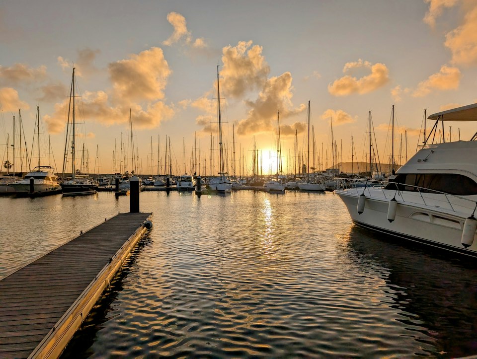 Boats moored in the marina at Playa Blanca, Lanzarote, at sunset