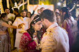Couple embraces during a traditional wedding ceremony.