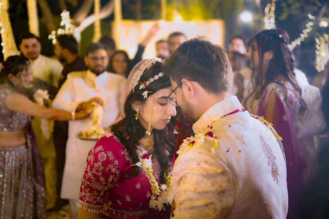 Couple embraces during a traditional wedding ceremony.