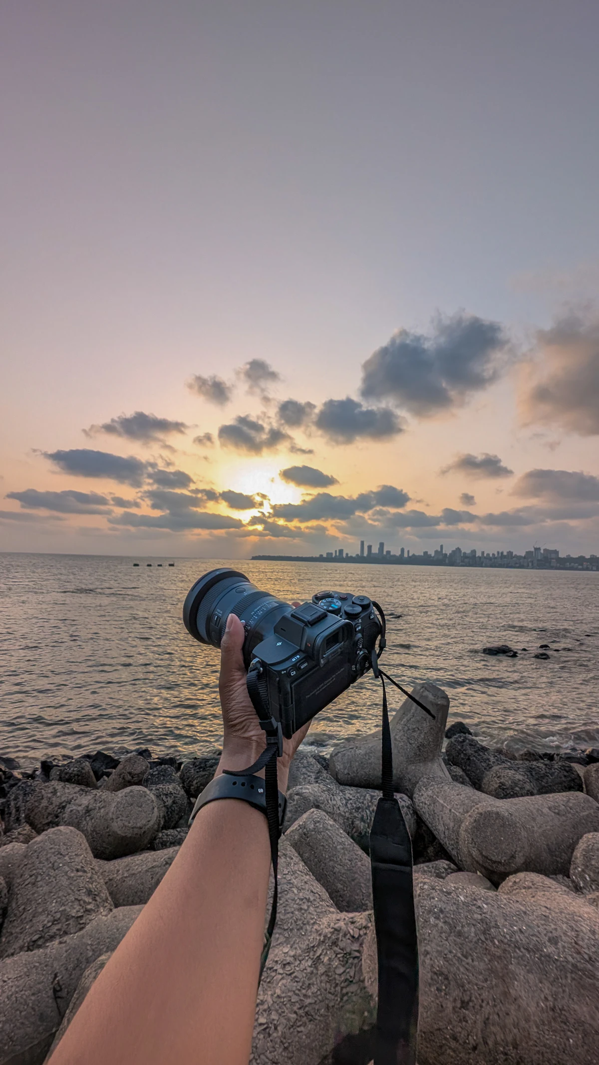Rooftop view of Mumbai city lights at sunset