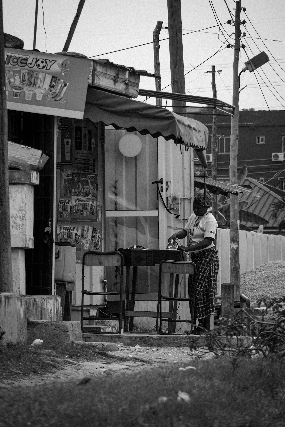 A woman running a small service business in Accra, Ghana