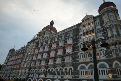 The taj mahal palace hotel shines in the evening.