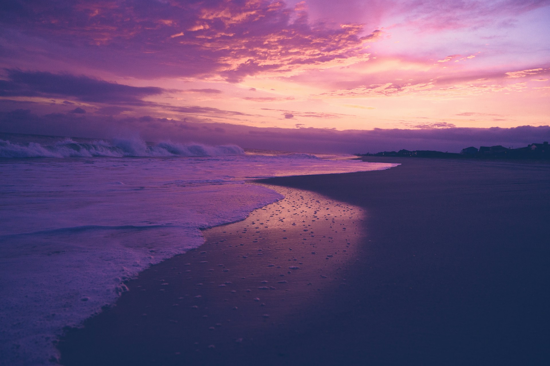 Beautiful purple sunset over a calm beach.