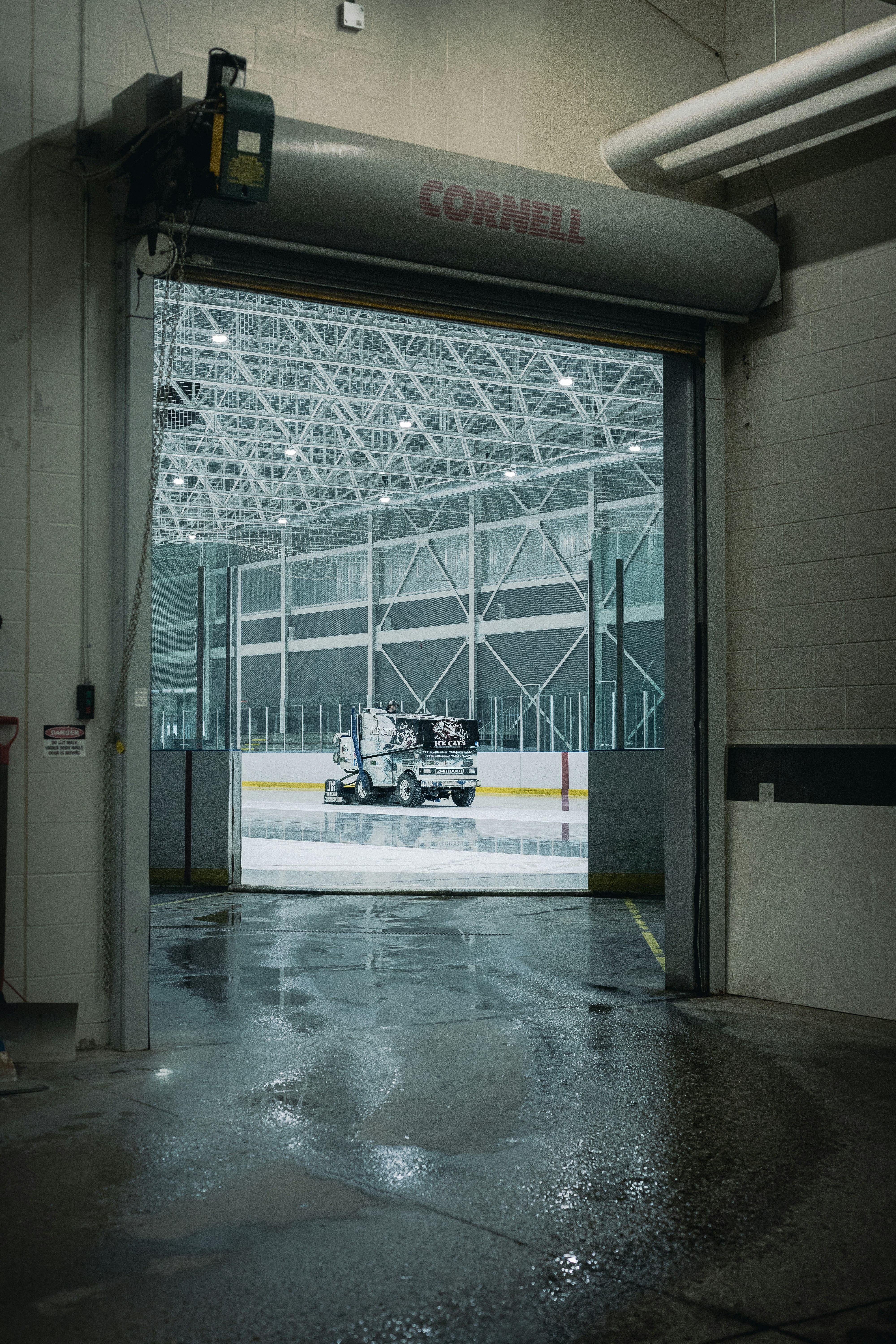 A zamboni prepares the ice at cornell university.