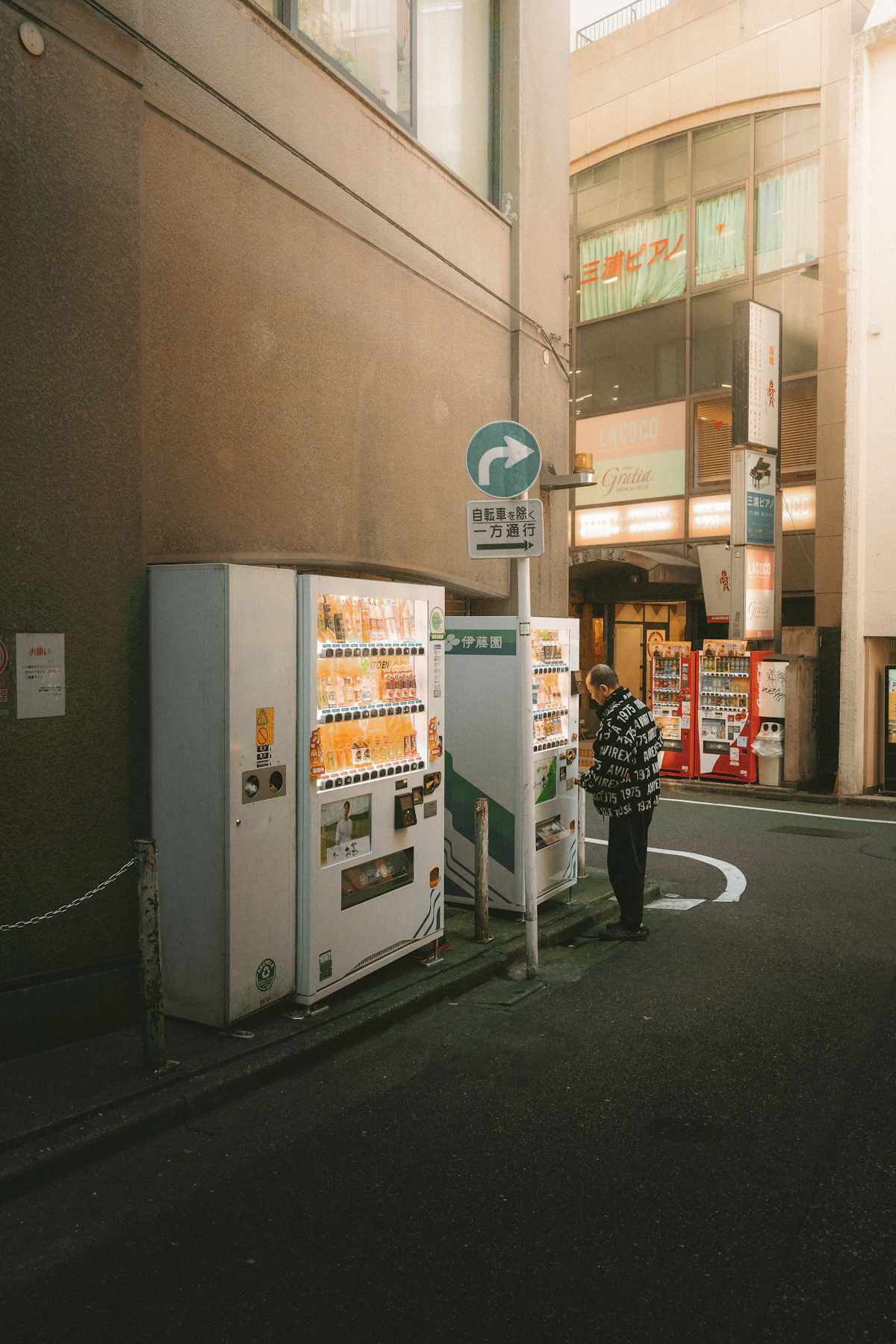 Compact camera, lens, and notebook laid out on a table