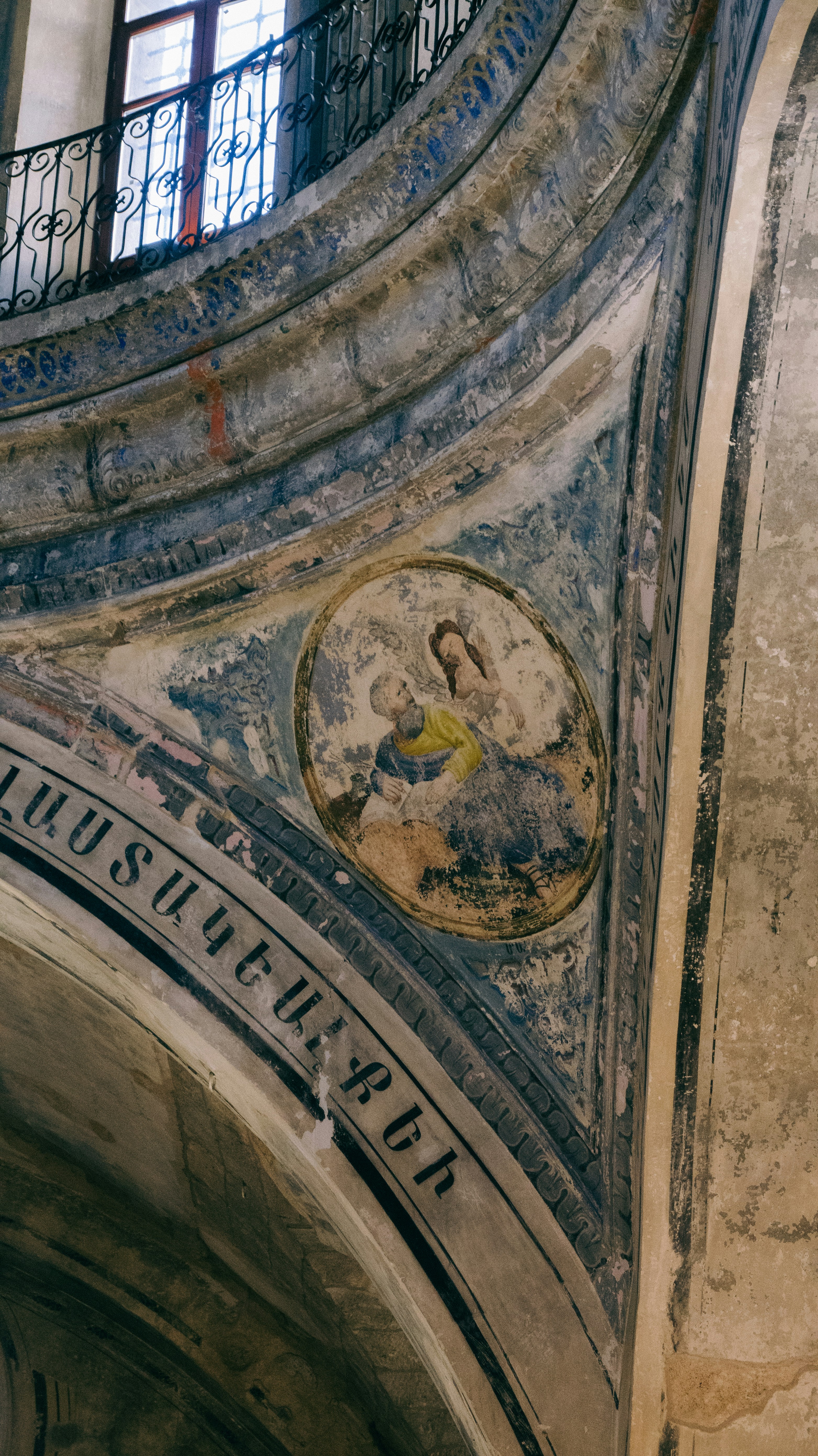 An old wall painting of religious figures.