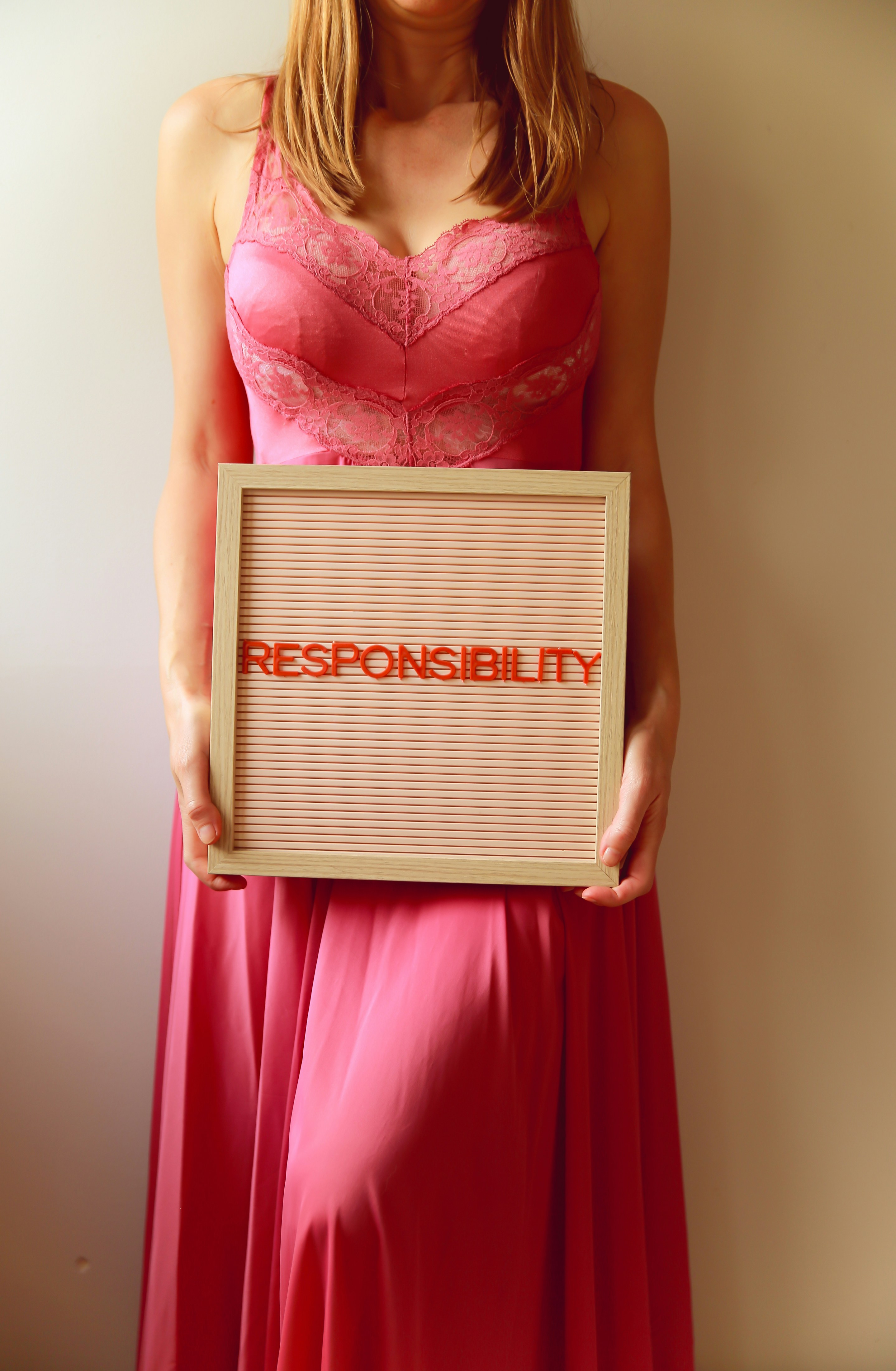 Woman holds a sign that says 