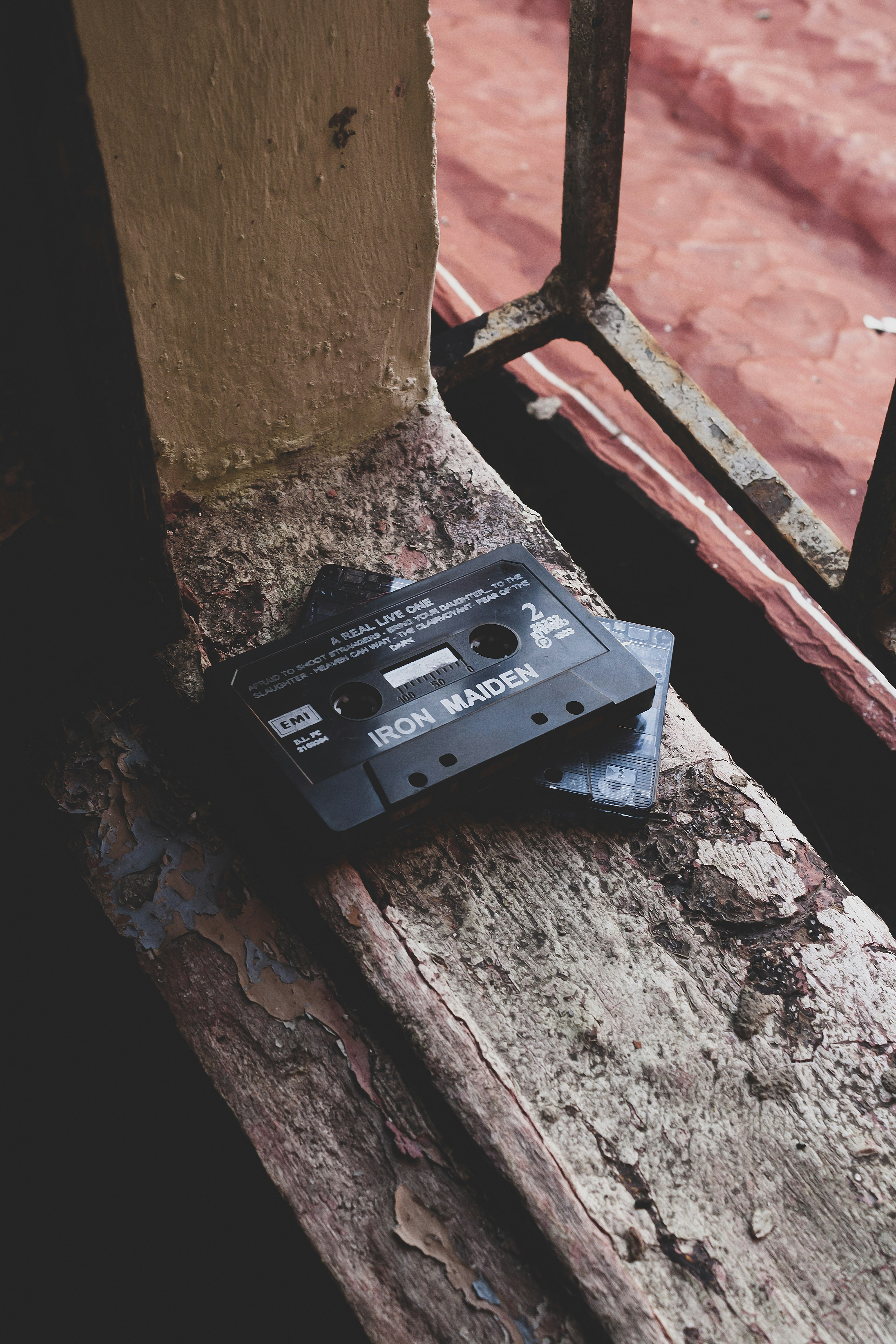 Iron maiden cassette tape sits on windowsill.
