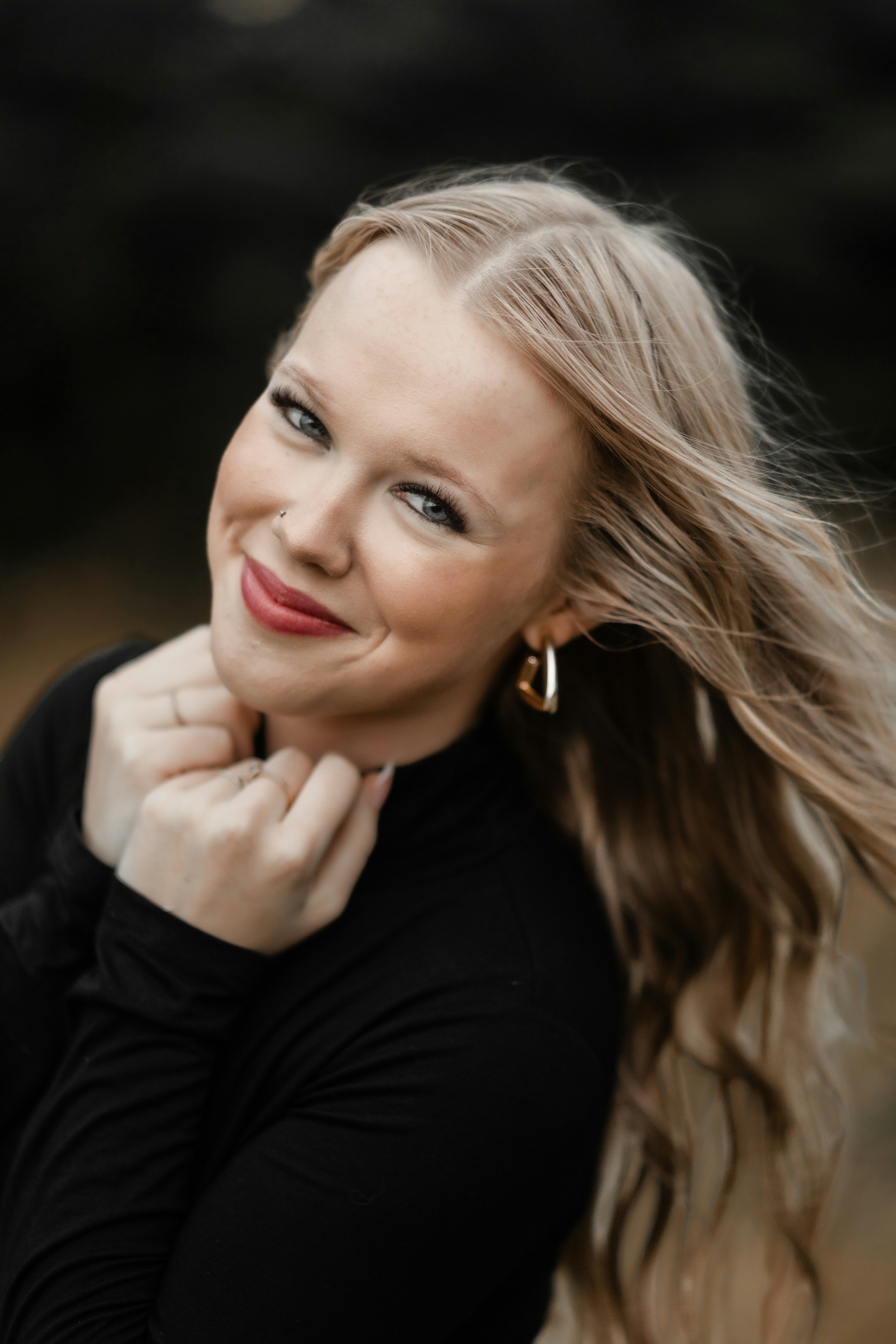 A beautiful woman smiles for the camera.