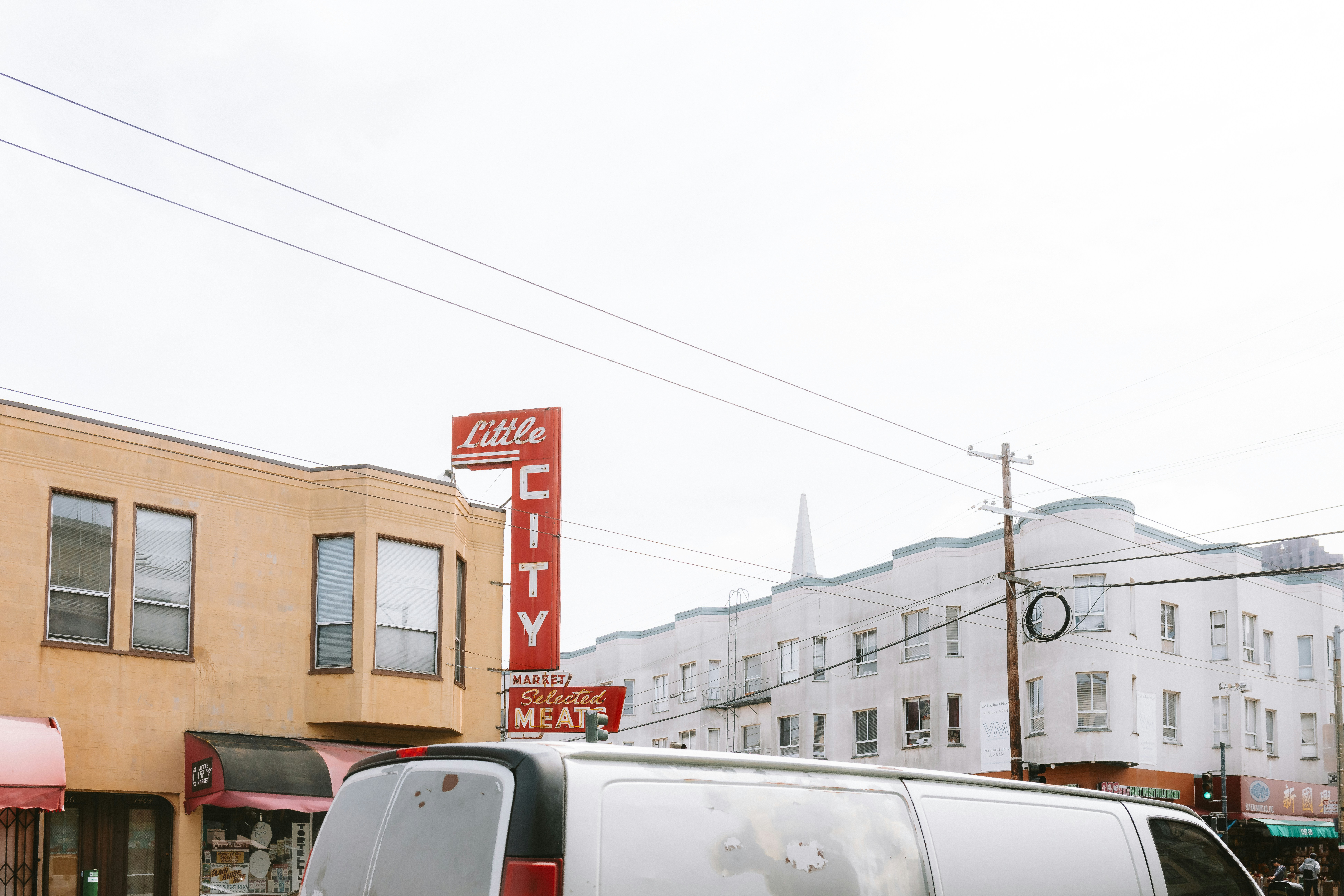 Buildings in the city under a cloudy sky.