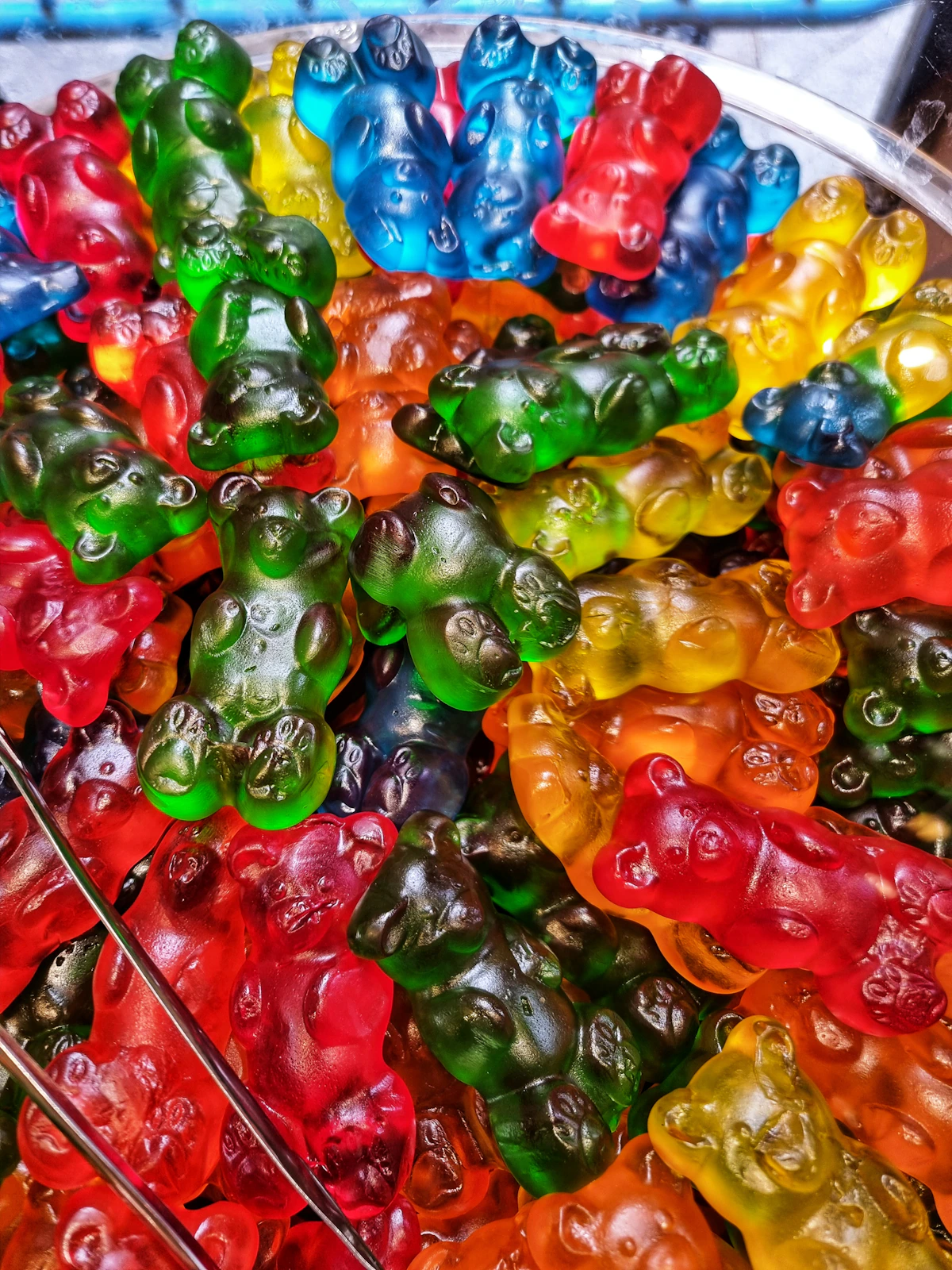 Colorful gummy candies in a tray; application illustration