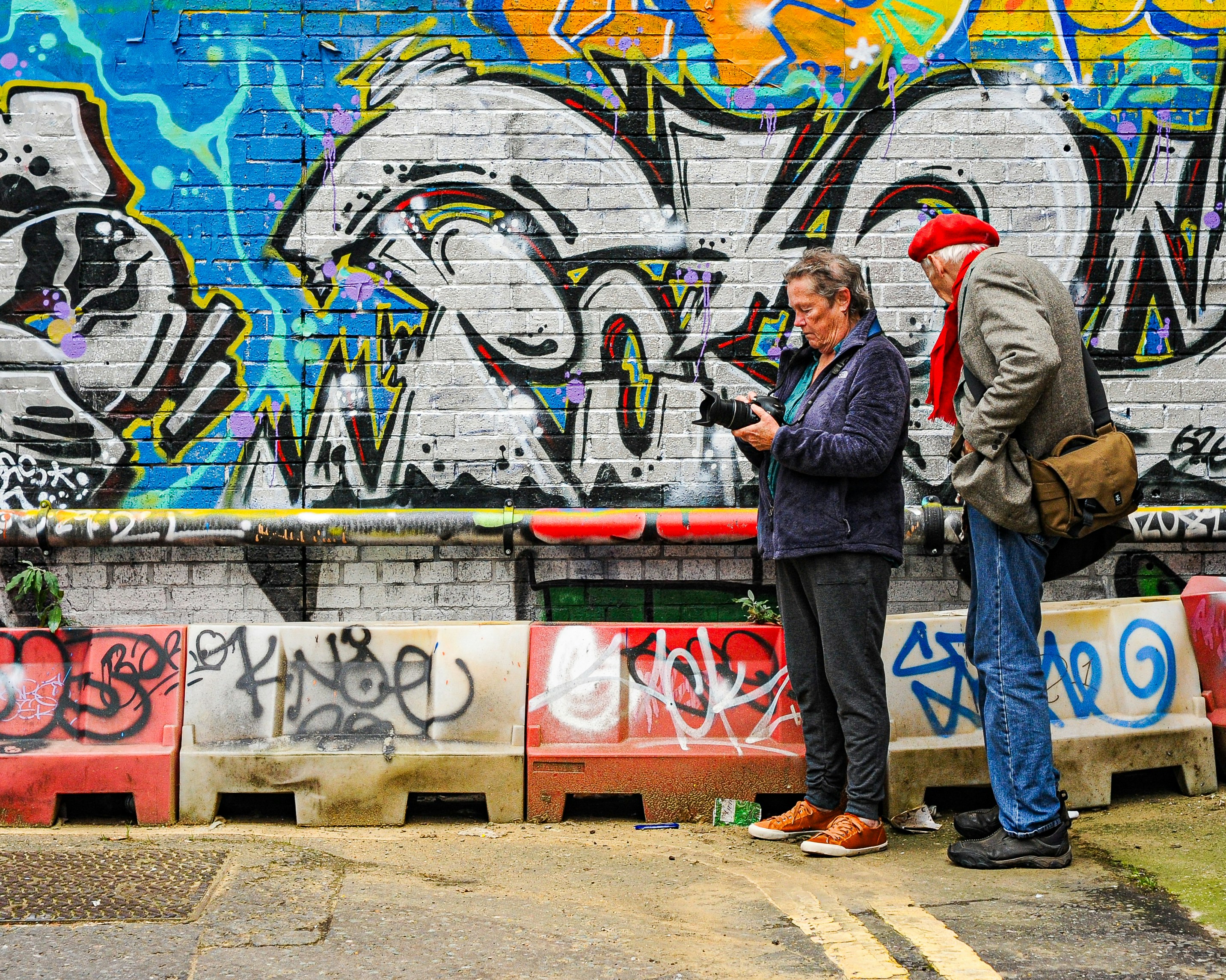 A couple exploring the street art in Hosier Lane