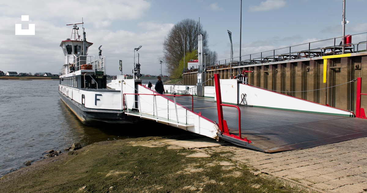 A ferry is docked and ready to load. photo – Free Transport Image on ...