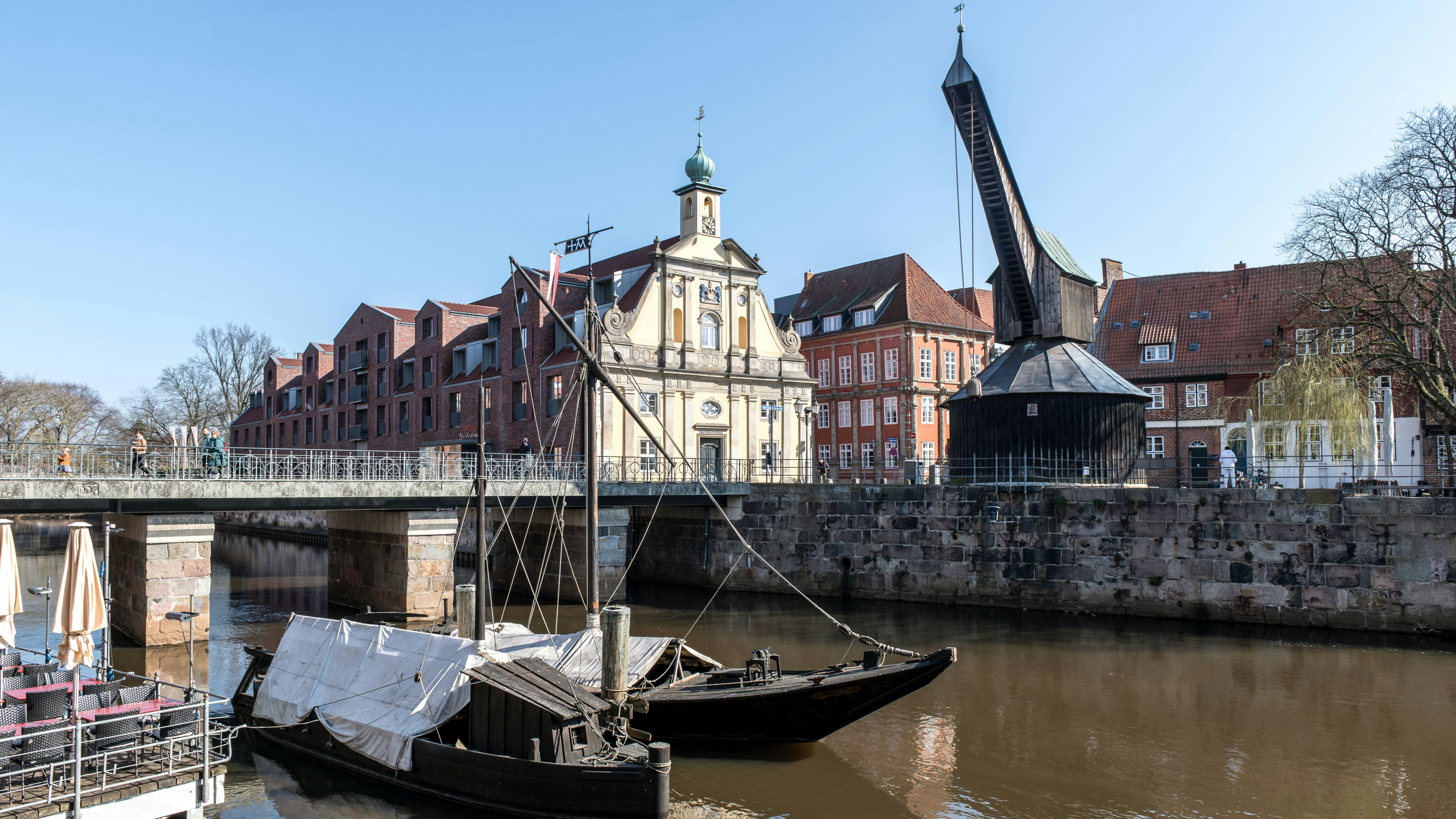 A picturesque river view with buildings and boats.
