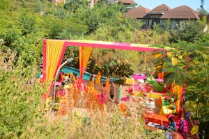 An outdoor wedding celebration with colorful decorations.