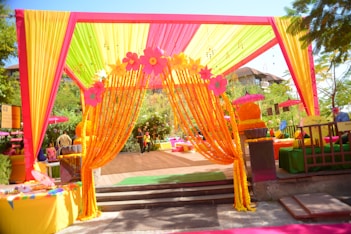 A brightly decorated outdoor event entrance.