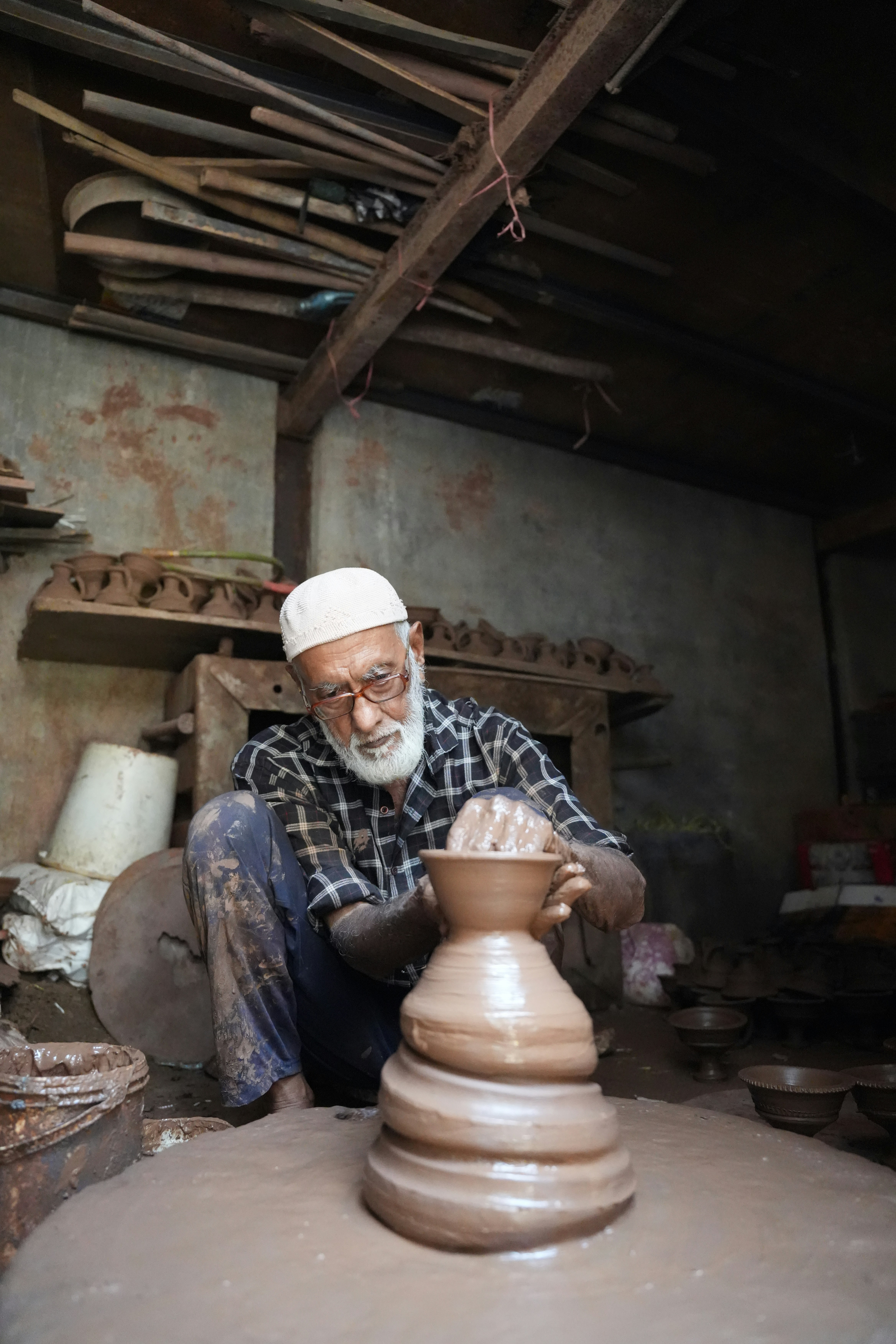 Moroccan artisan crafting pottery