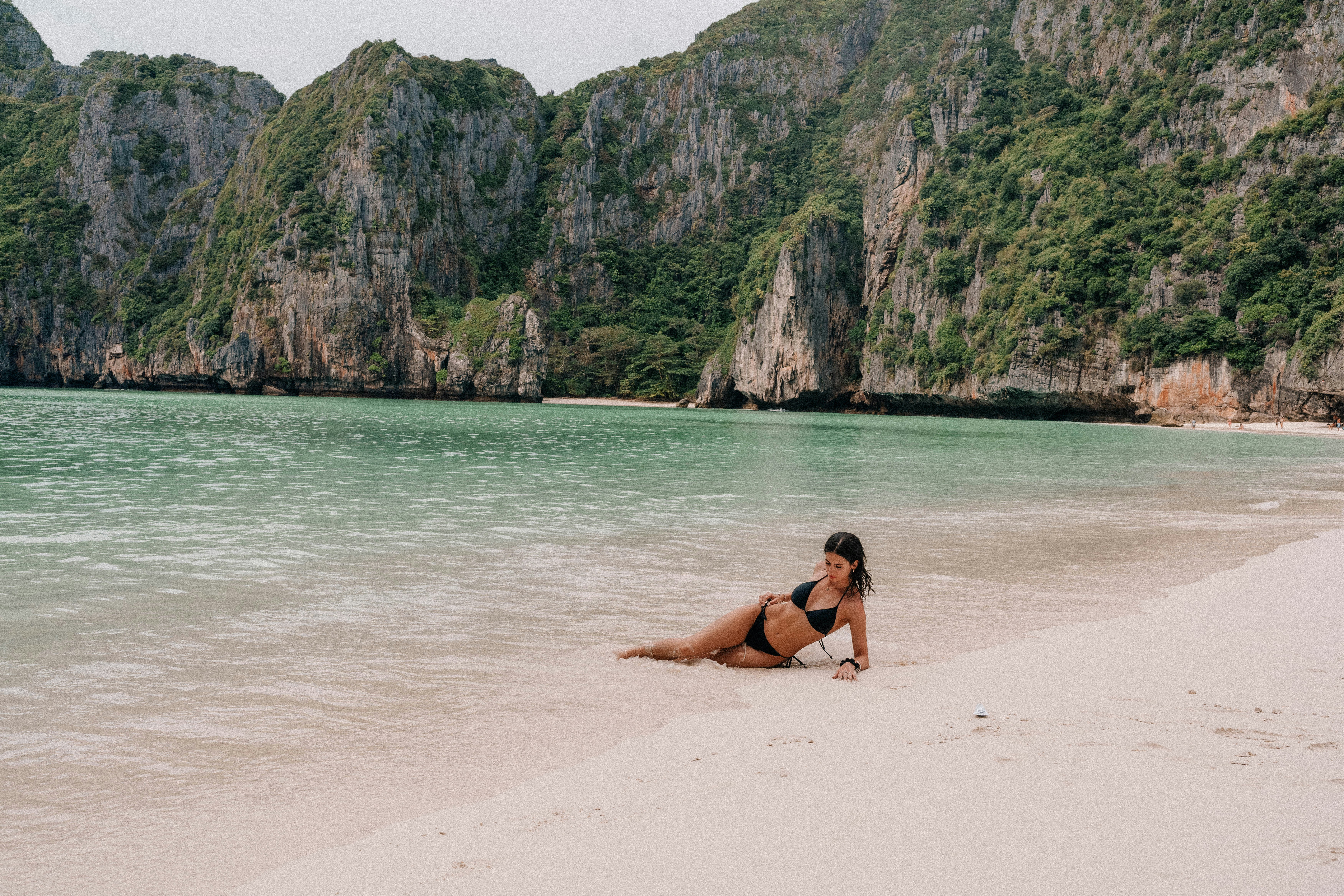 Woman relaxes on a beautiful sandy beach.