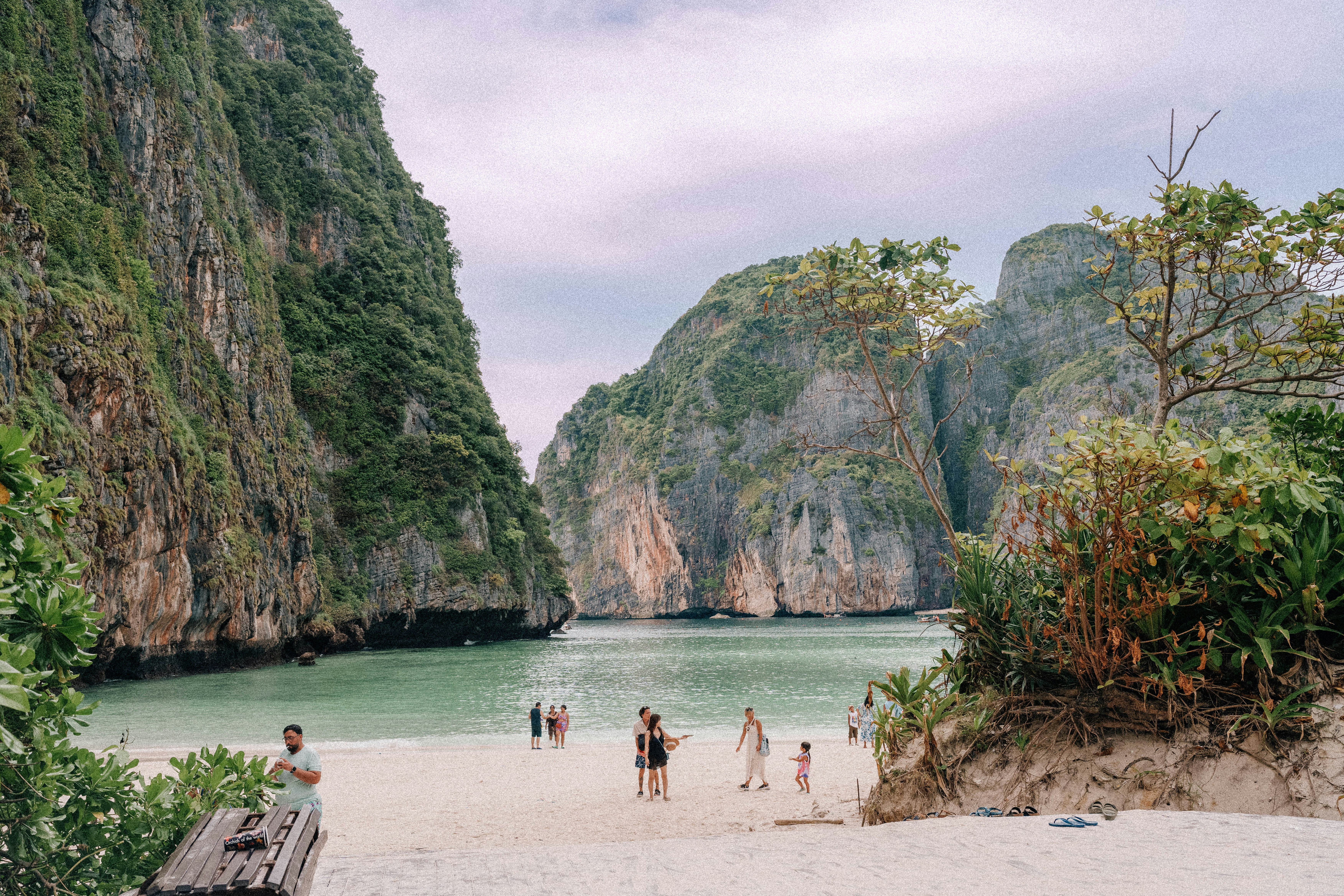 Beautiful beach surrounded by towering limestone cliffs.