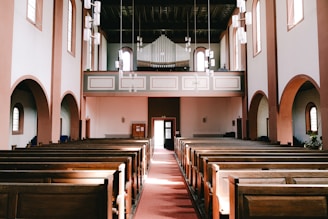 Inside of a grand church, empty of people.