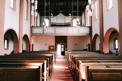 Inside of a grand church, empty of people.