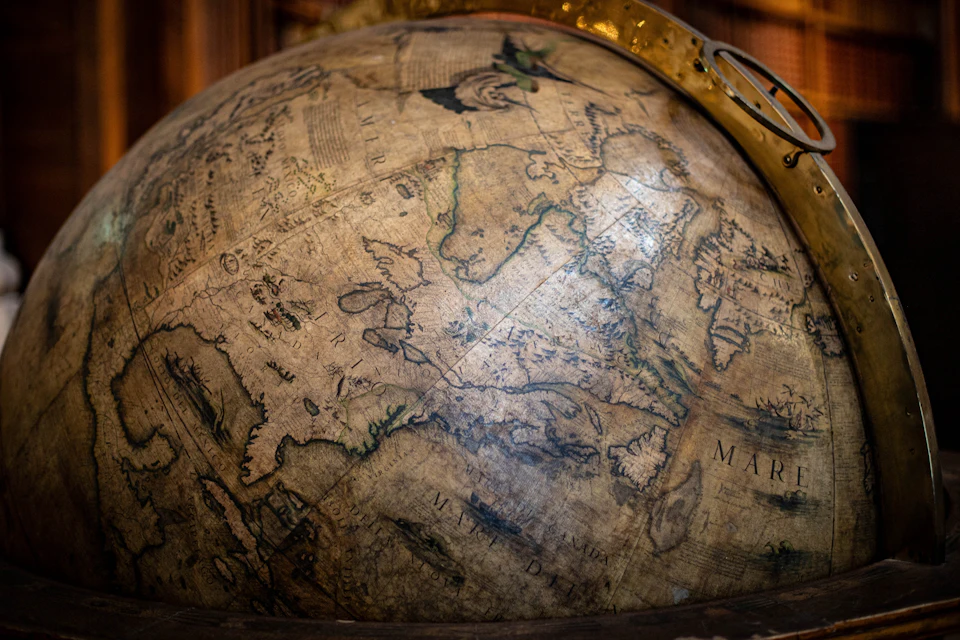 An old globe showing world maps