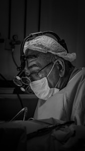 Surgeon focused on an operation in progress.