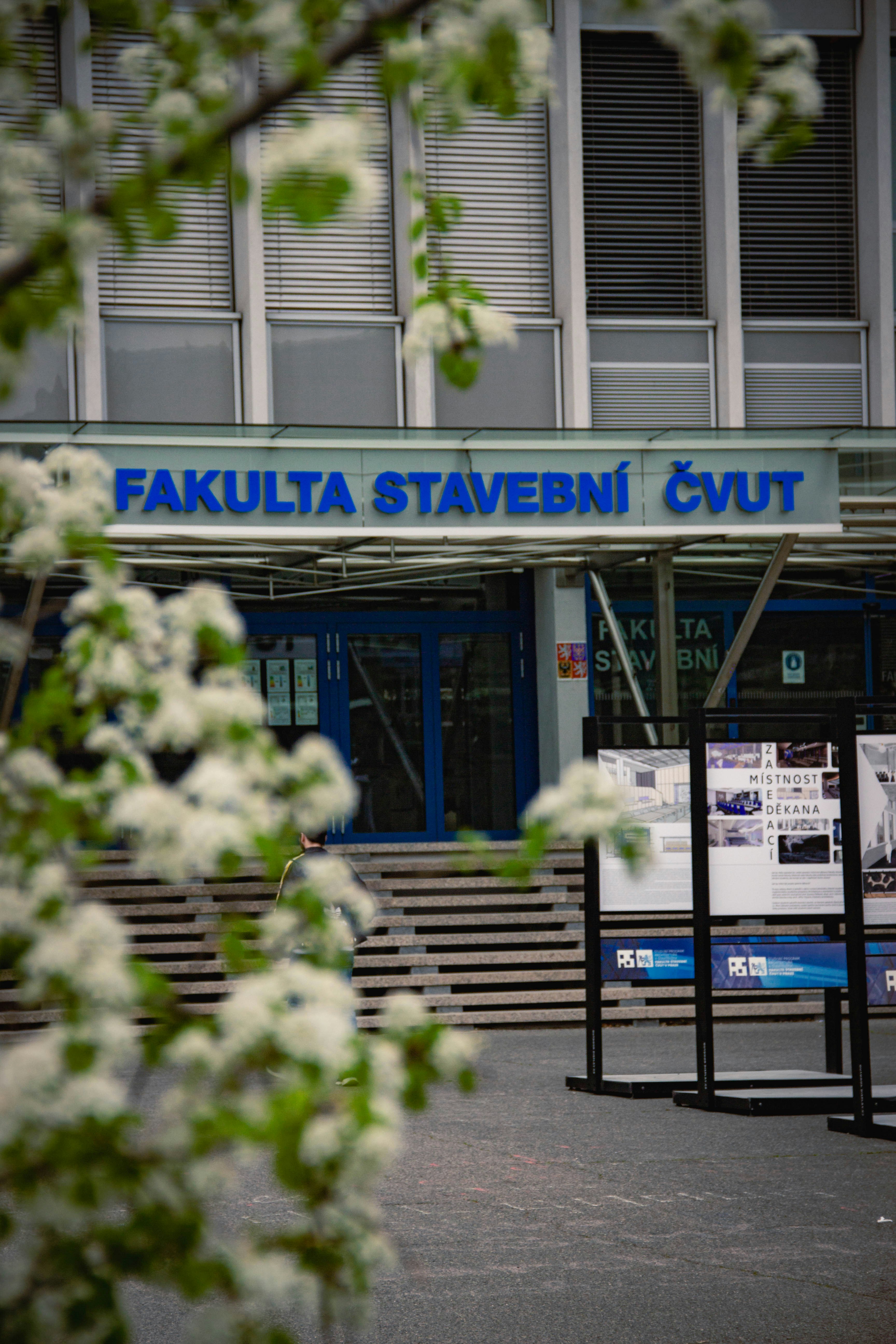 Building faculty with flowers and information boards.