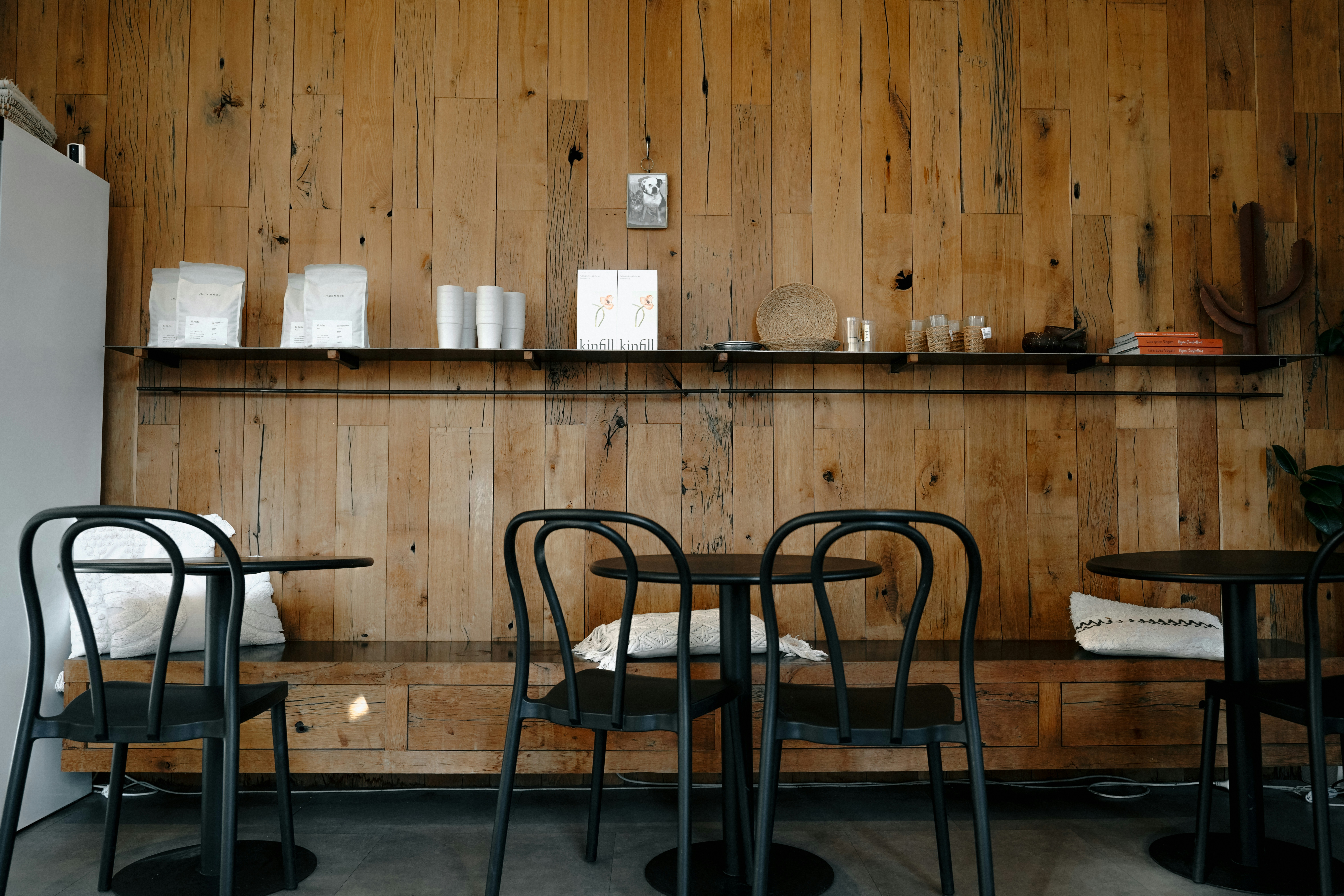 A cozy café interior with tables and chairs