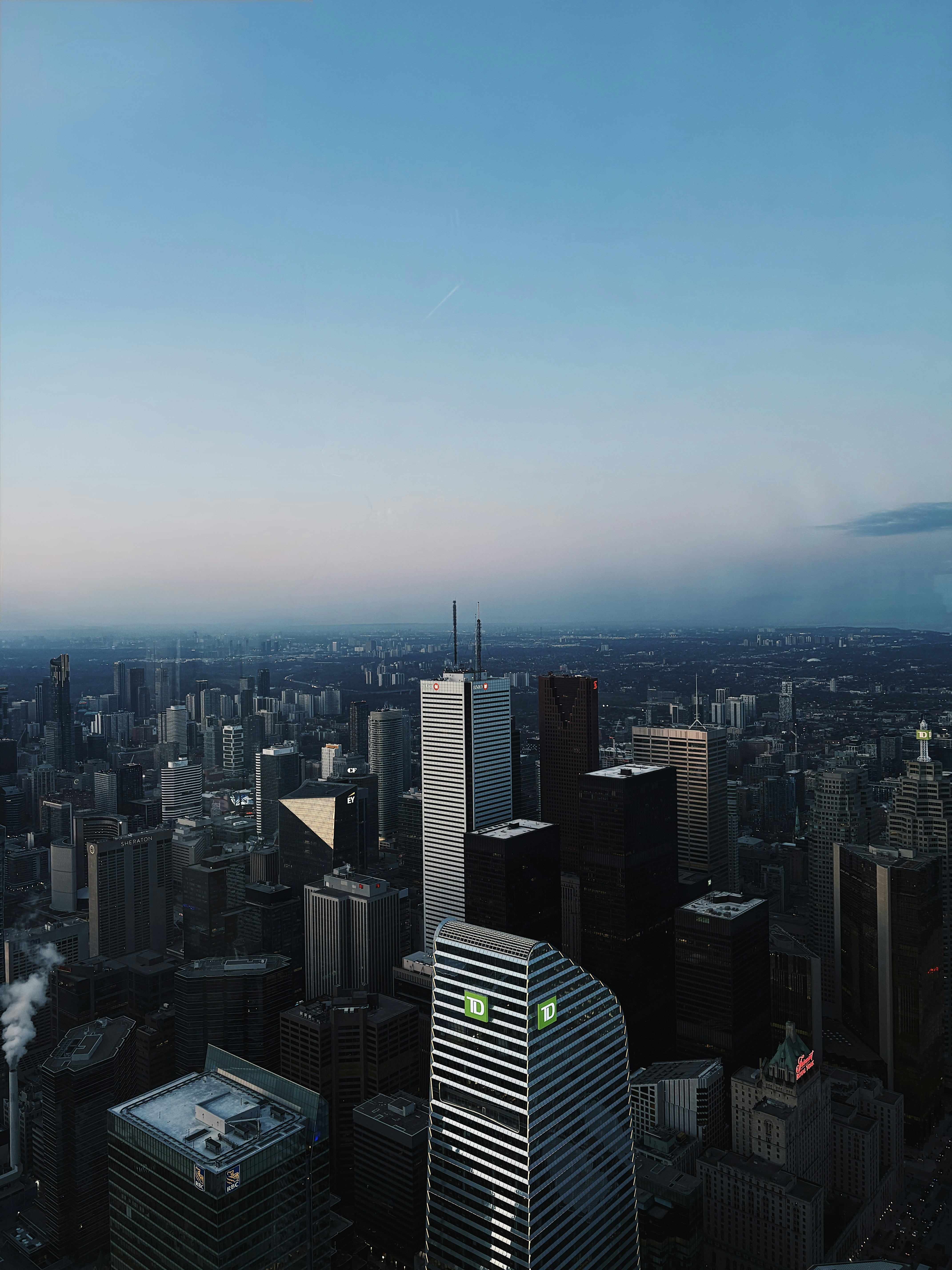 Aerial view of a city skyline at dusk.