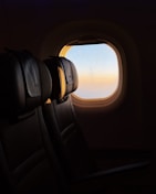 Sunrise seen from an airplane window.