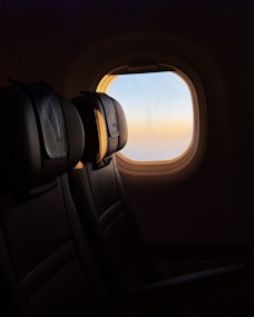 Sunrise seen from an airplane window.